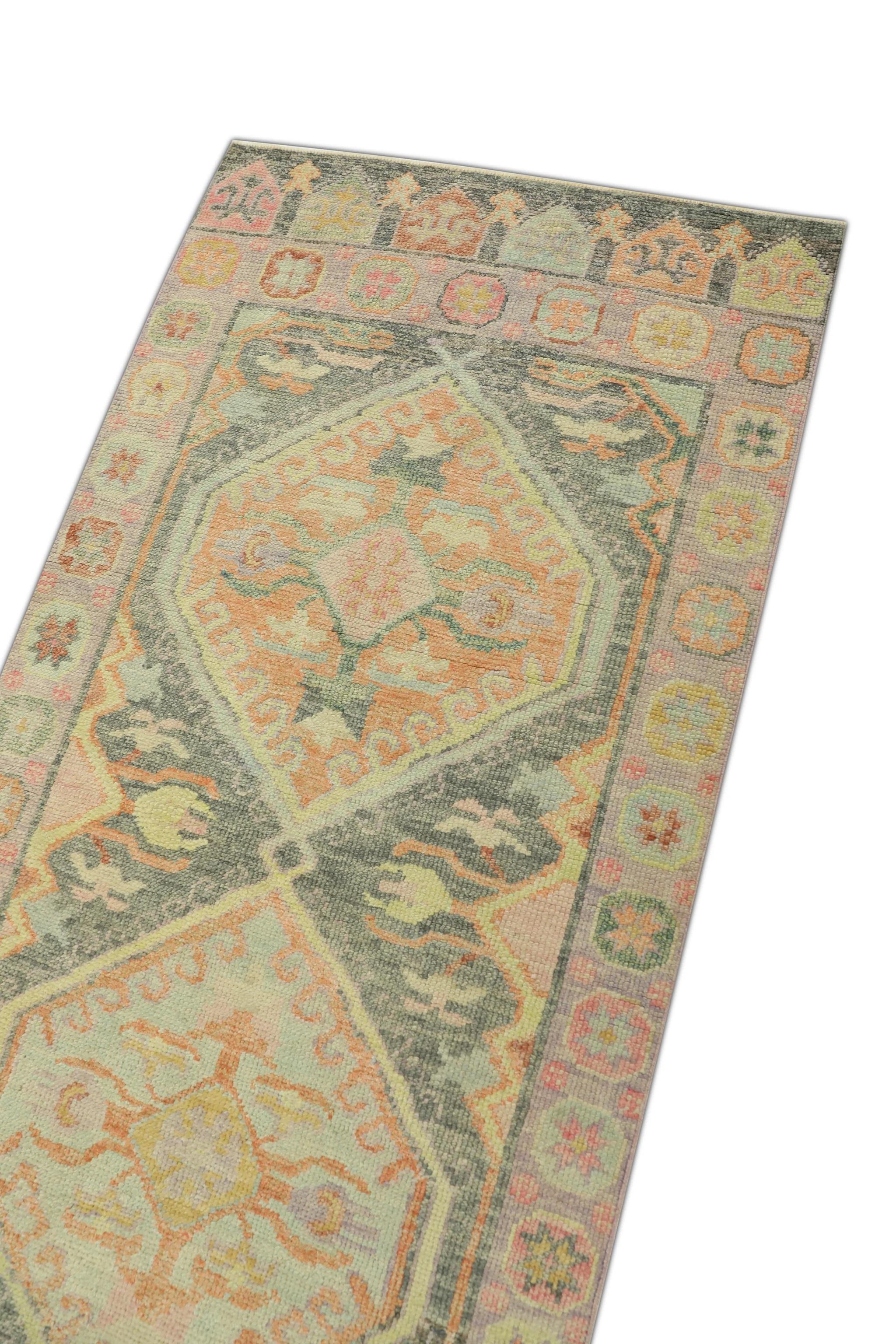 This Turkish oushak rug is a stunning piece of art that has been handwoven using traditional techniques by skilled artisans. The rug features intricate patterns and a soft color palette that is achieved through the use of natural vegetable