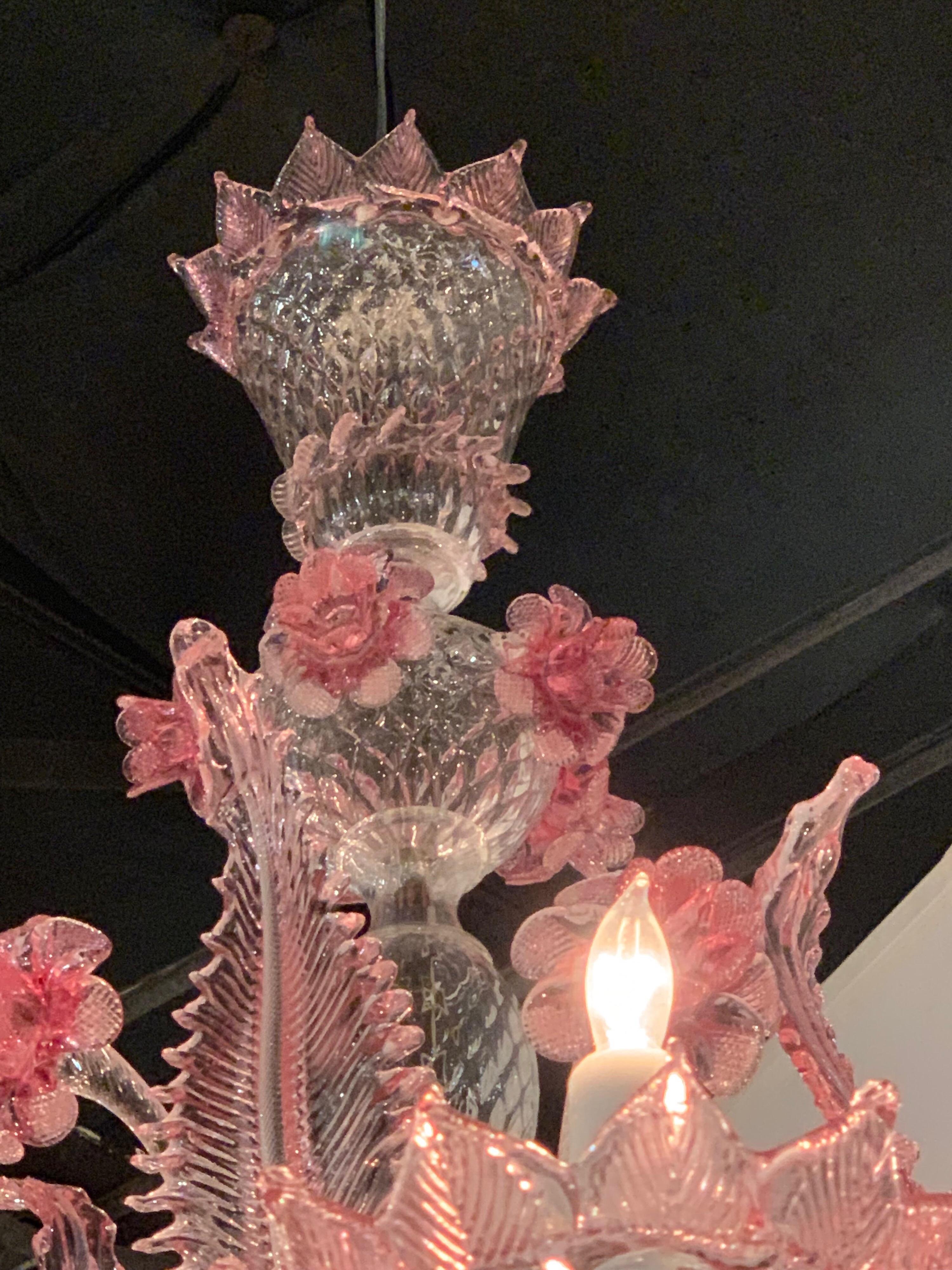 Very pretty pink Murano 8-light chandelier. Lovely leaves and flowers in a pale pink. Nice scale on this piece. Just cleaned and re-wired and ready to hang! Matching chain and canopy included.