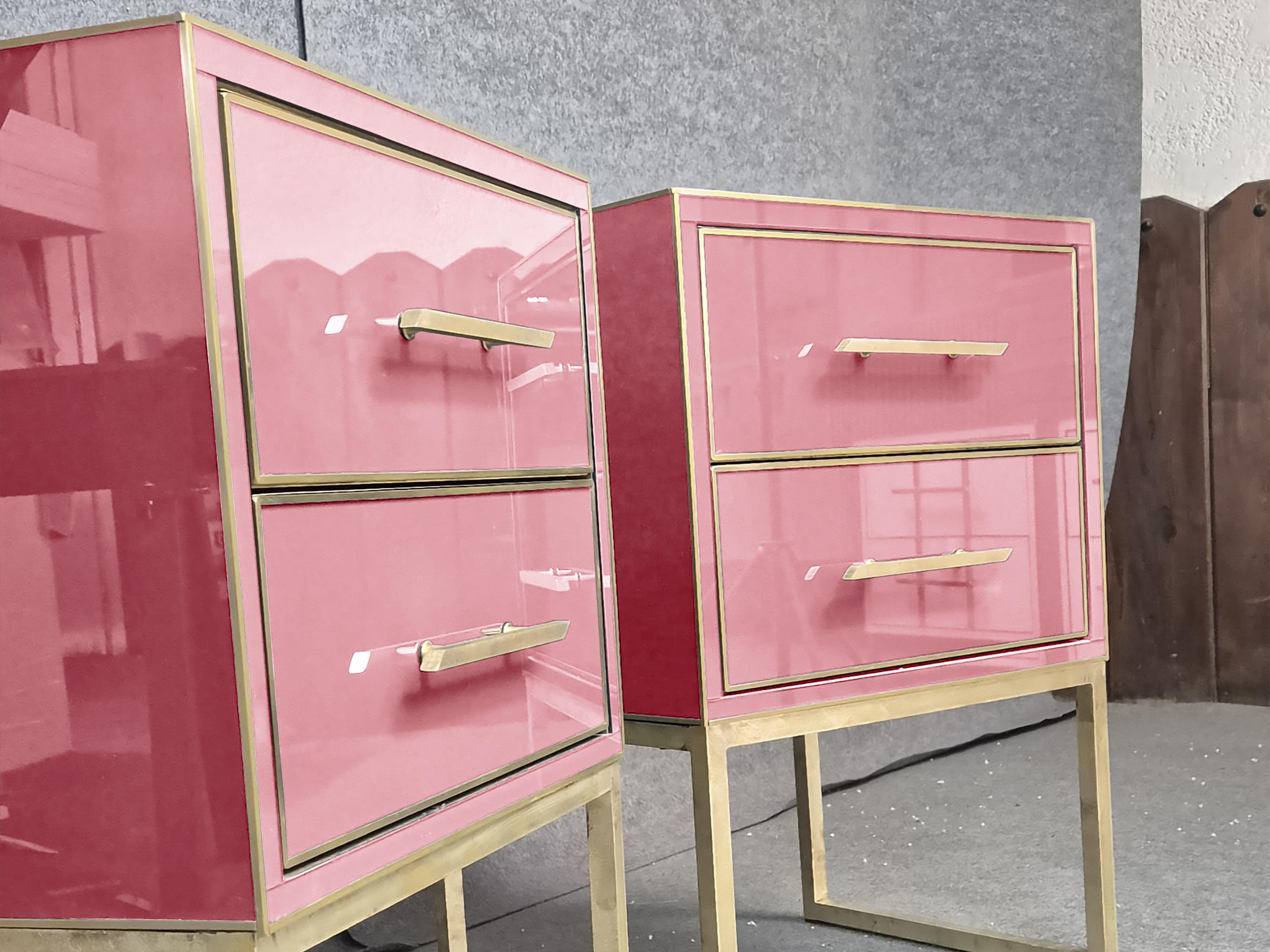 These luxury bedside tables in pink Murano glass and brass exemplify exquisite Italian craftsmanship and Mid-Century Modern style. 

Handcrafted in Italy exclusively for Milan Fashion Week, each bedside table features a solid wood frame with