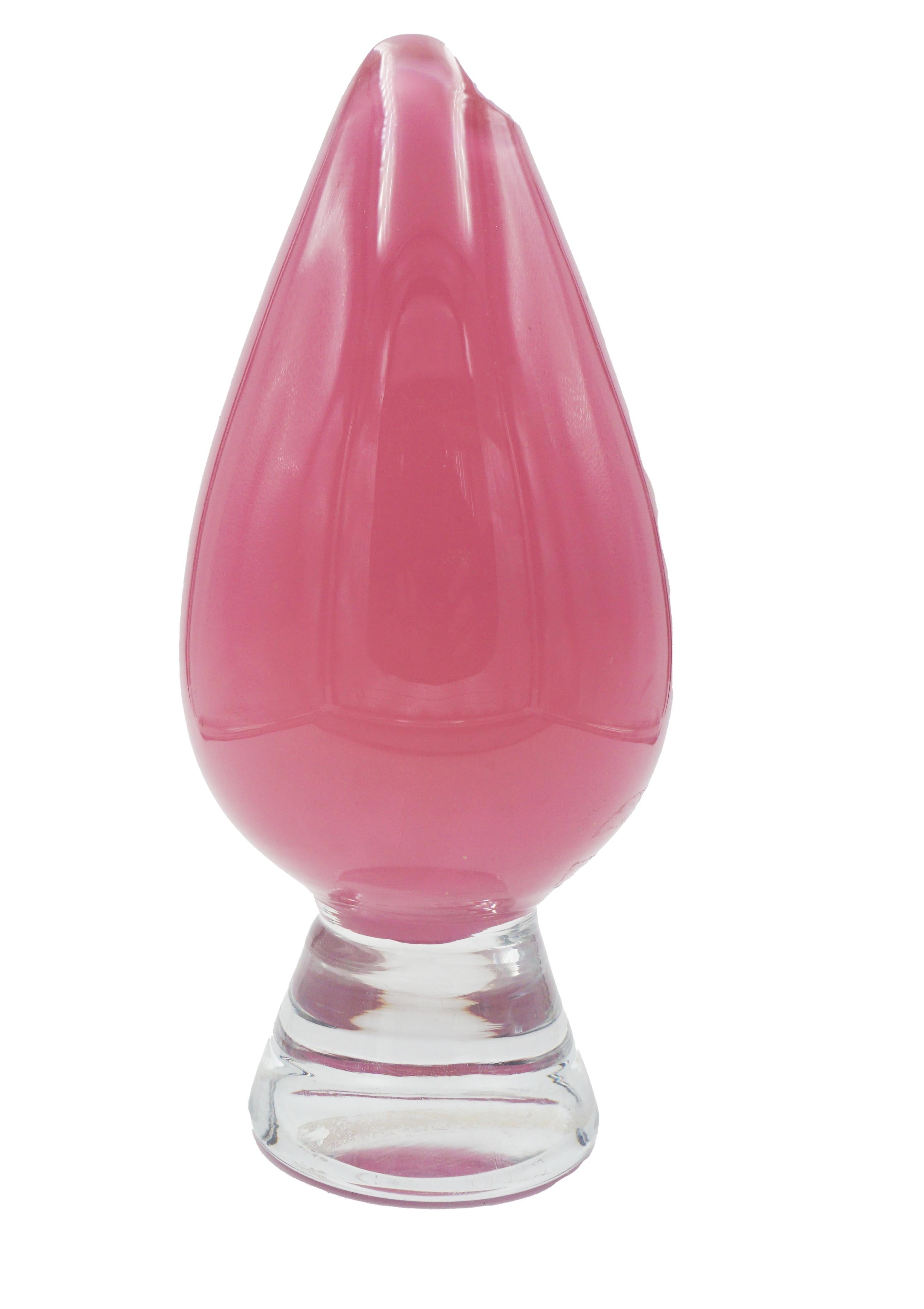 Beautiful vintage Murano, hand blown, Italian glass vase. This thick Murano vase depicts a very elegant solid blush pink top with a clear glass layer over the pink and a clear base. This exceptional shape mirrors the shape of a flower bud. Made in