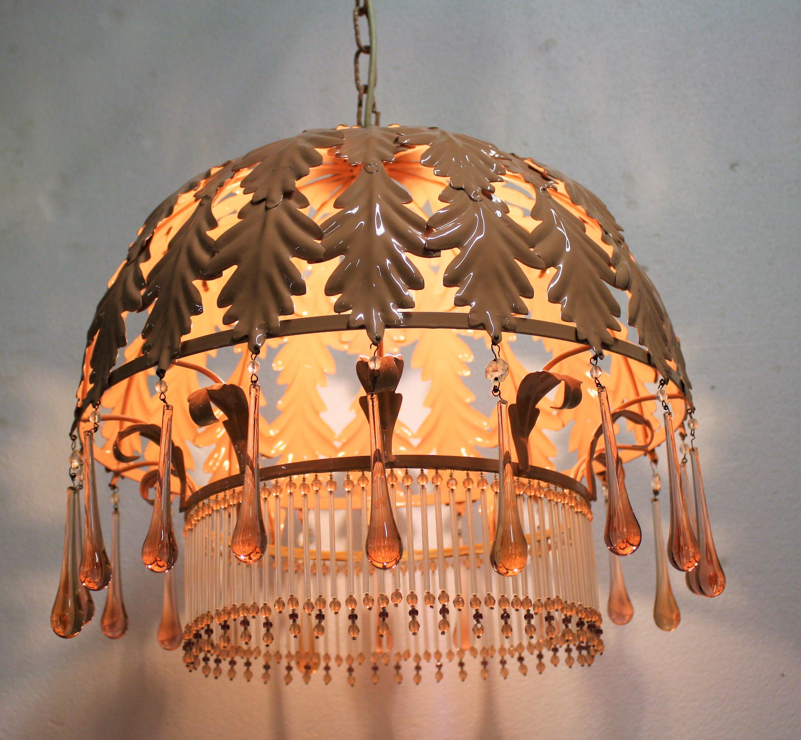 Vintage pink leaf motive chandelier made from metal with crystal Murano glass teardrops.

The lamp emits a beautiful, warm welcoming light.

This unusual chandelier is in very good condition, and has been tested and is ready for use.

It has a