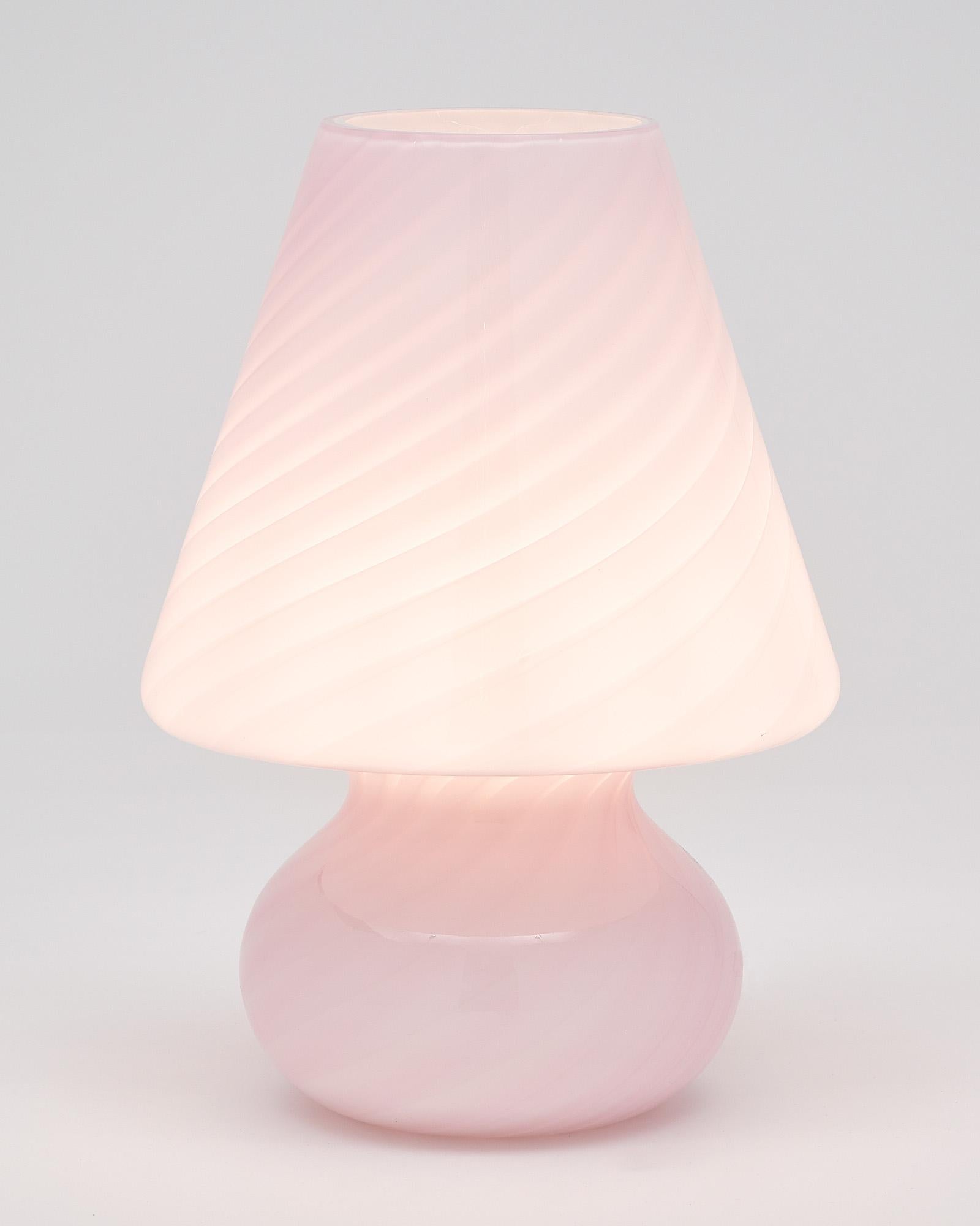 Glass lamp from the island of Murano. This hand-blown artful piece combines pink and white glass in a swirly dynamic. It has been newly wired to fit US standards.