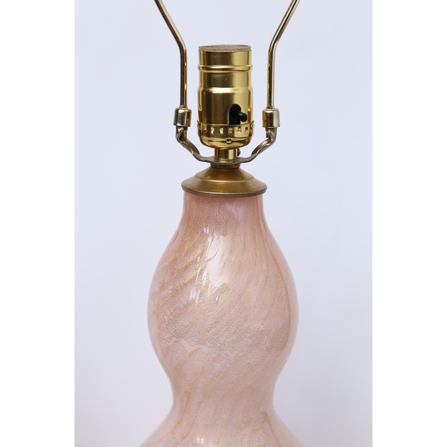 Beautiful pair of Murano glass lamps with Lucite base. Price listed is for the pair.