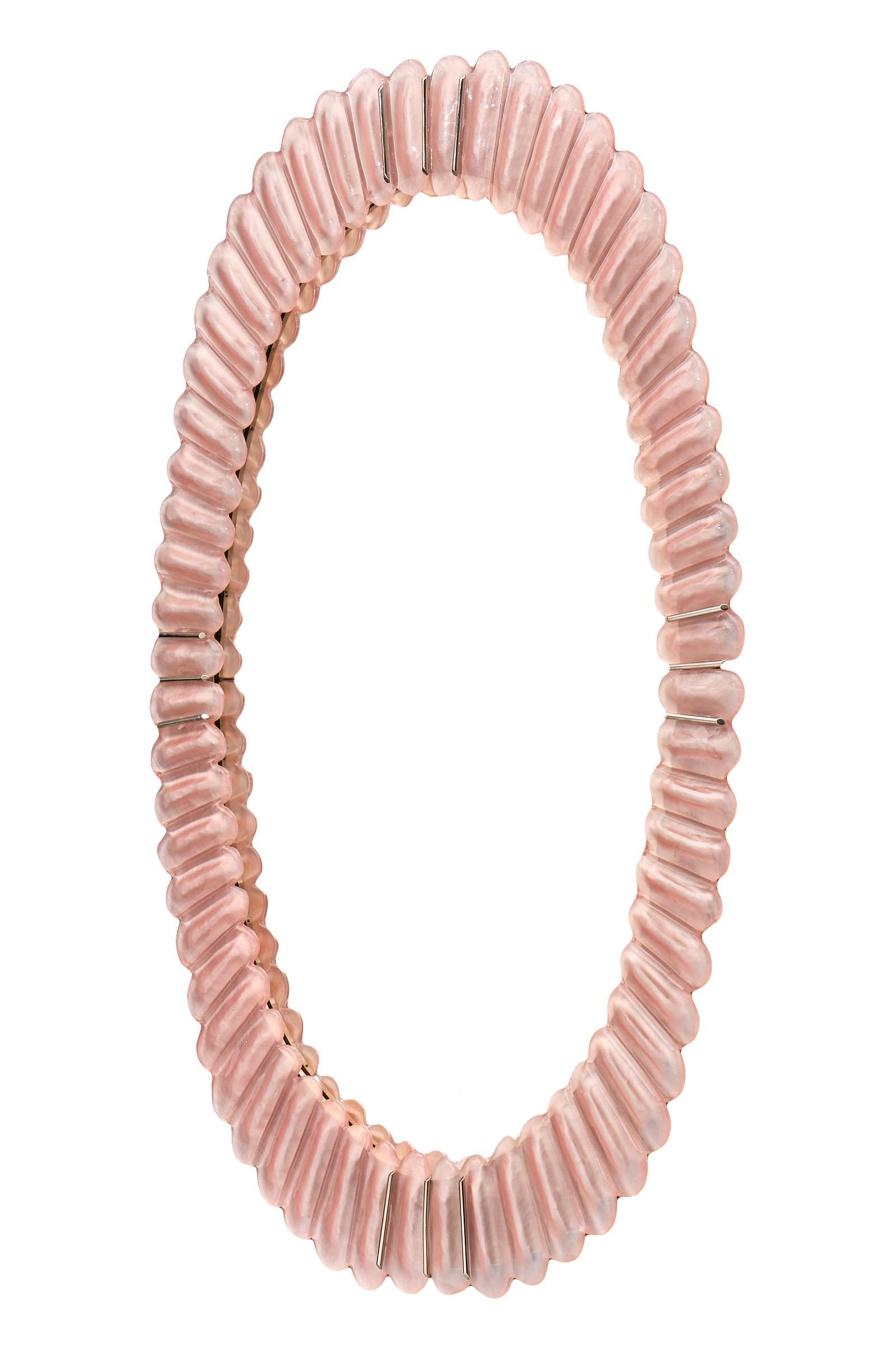 Murano glass pink mirror by Fuga. This Italian piece has hand blown glass elements in the loveliest pink hue. Each oval component is fused together to form a crown, enhancing the decorative impact of these beautiful, organic mirrors. We love the