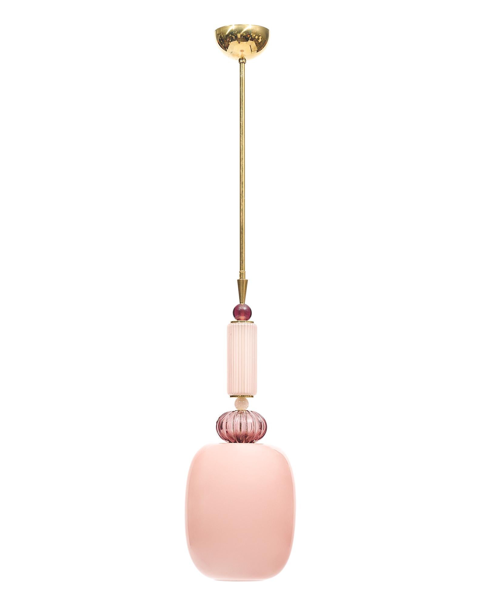 Pair of Murano glass frosted pendants in the style of Ettore Sottsass. This pair includes hand-blown glass elements in a variety of pink hues and techniques on a brass structure. The warm color contrasts perfectly with the adventurous design. They