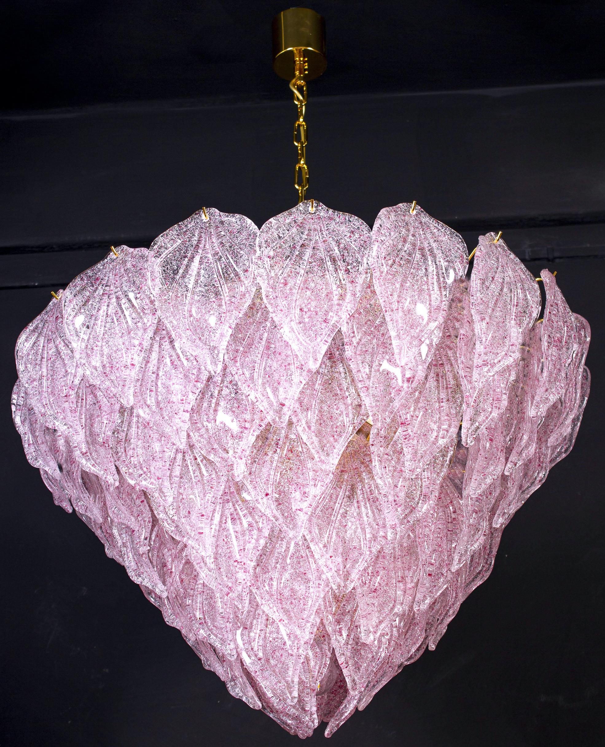 Murano polar pink chandelier, each with 88 precious hand blown glass leaves hanging on the brass frame. Spectacular light effect.
Available also a pair and four pair of sconces.

Measures: Height 75 cm, with chain 130 cm
Ten E 27 lights bulbs.
This