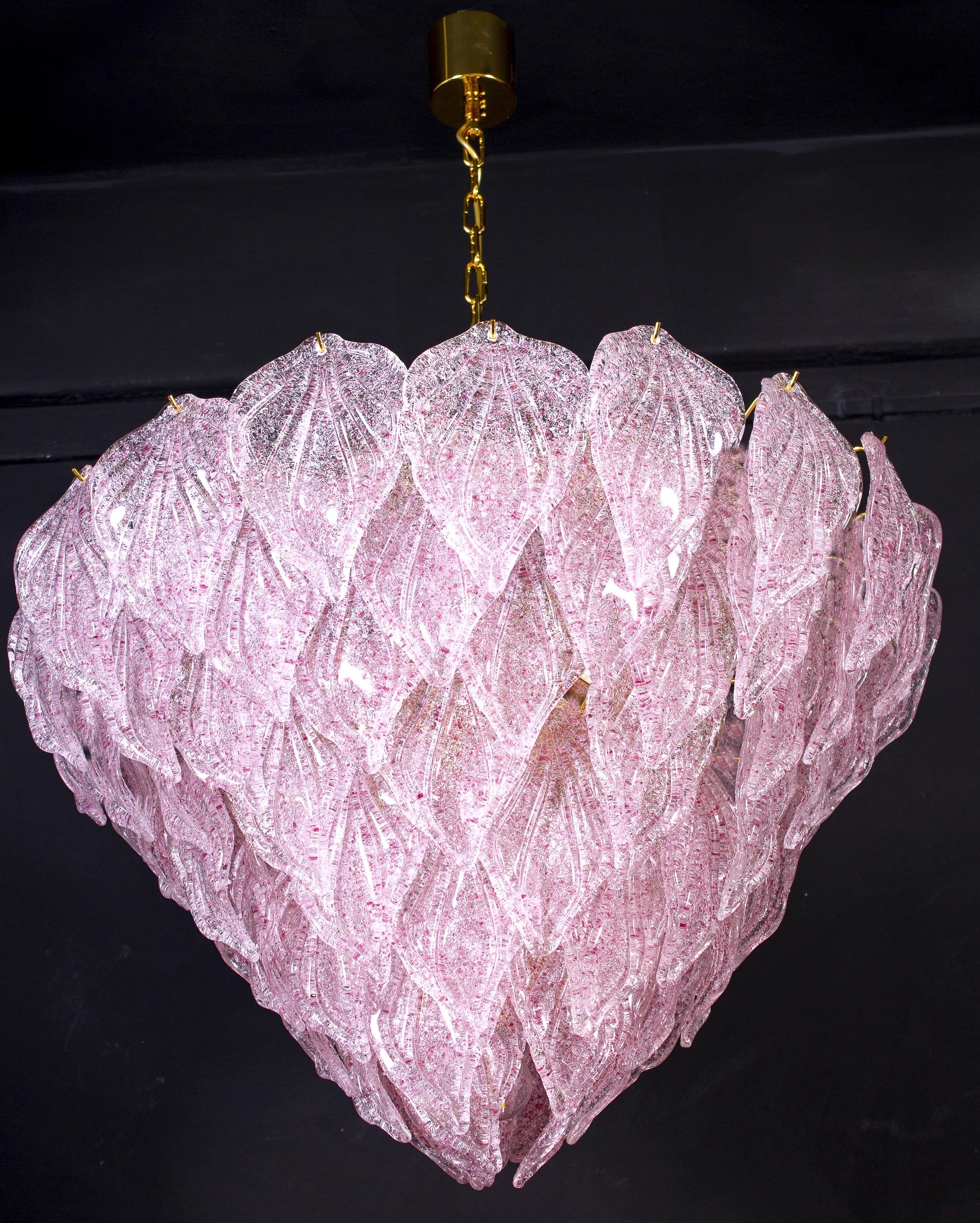 Murano polar pink chandelier, each with 88 precious hand blown glass leaves hanging on the brass frame. Spectacular light effect.
Available also a pair and four pair of sconces.

Measures: Height 75 cm, with chain 130 cm Diameter cm 85
Ten E 27