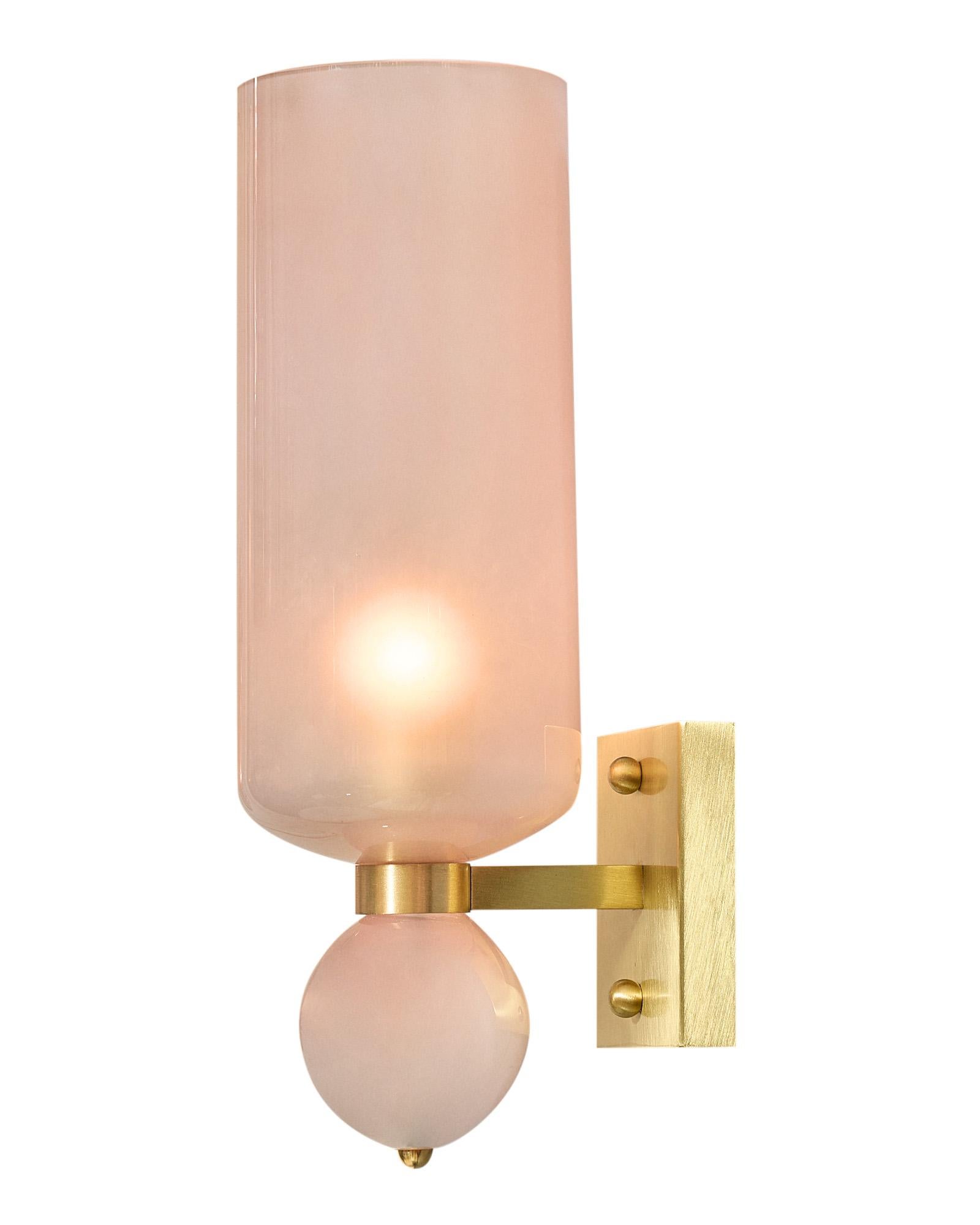 Pair of sconces, Italian, from the Island of Murano outside of Venice. The torchiere sconces feature hand blown pink pearlescent glass components on a polished brass structure. They have been newly wired to fit US standards.
