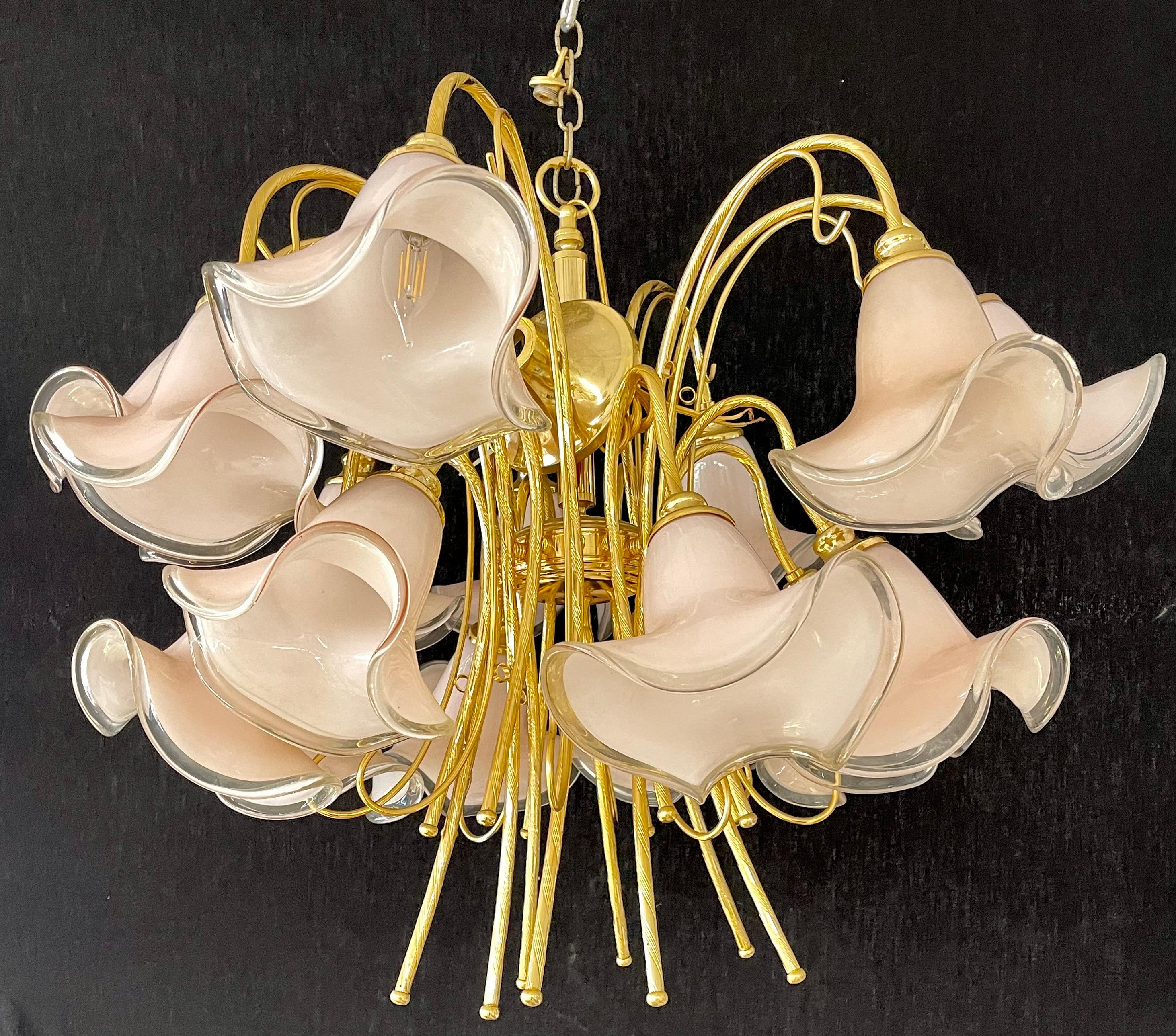Pink murano glass tulip-form brass chandelier having a center brass support with large impressive murano glass tulip form shades. Having 16 lights.