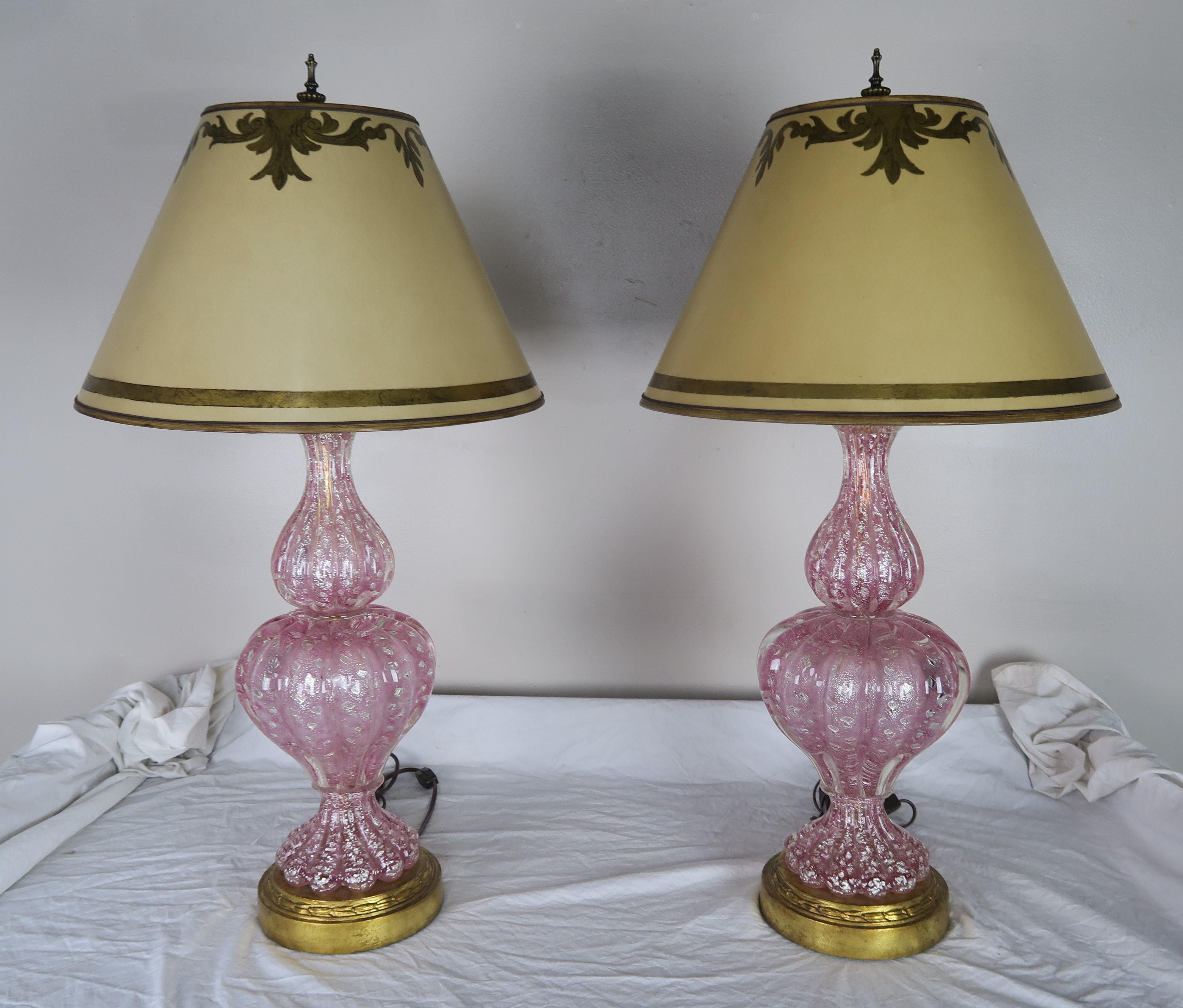 Pair of hand blown soft pink colored Murano lamps on gold leaf bases. The lamps are crowned with hand painted parchment shades. The lamps are newly rewired and are ready to install.