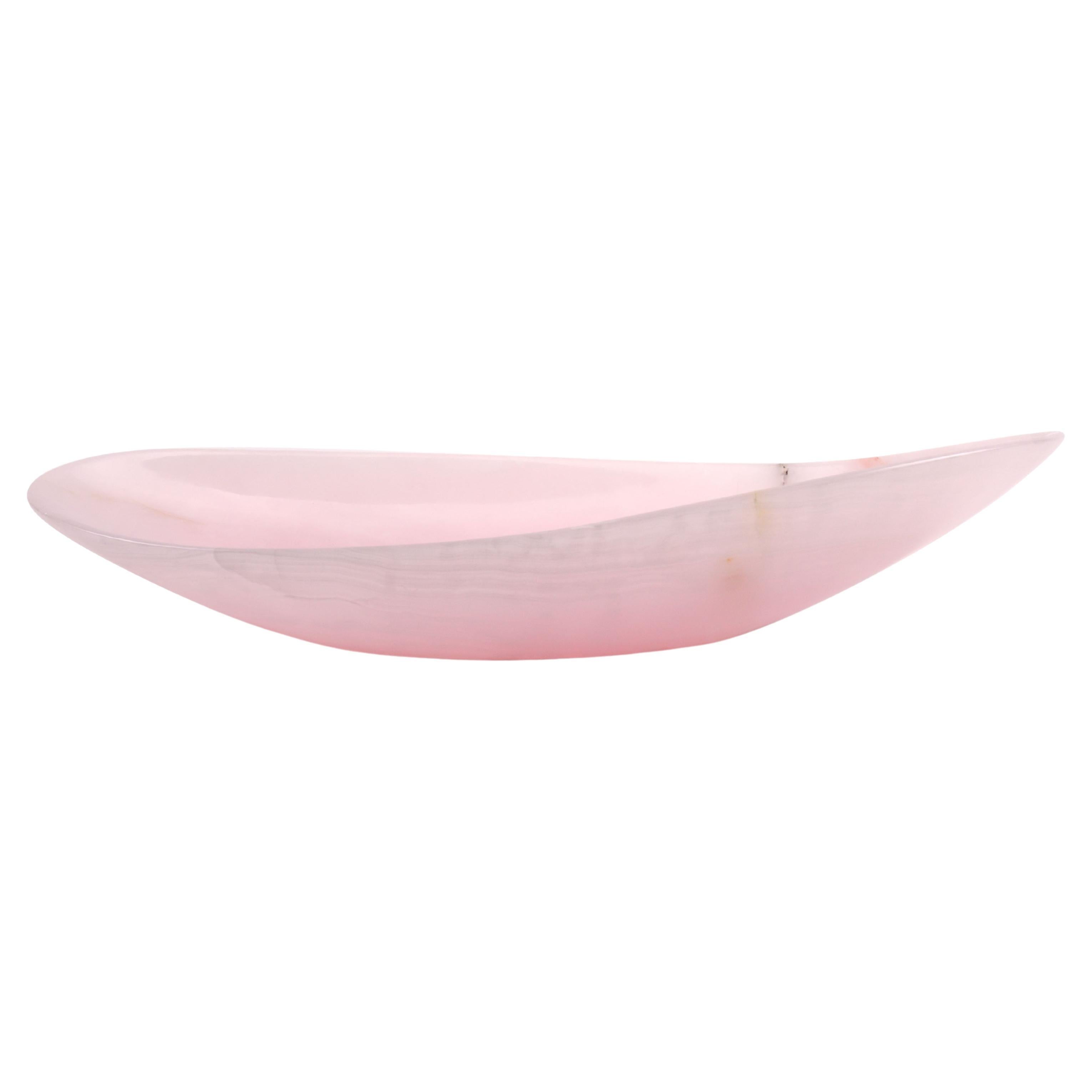 Bowl sculpted by hand from a solid block of Pink onyx. The polished finishing underlines the transparency of the onyx making this a very precious object. 

Bowl dimensions: Medium L 45 x W 22 x H 10 cm. 
Also available Big L 56 x W 27 x H12 cm.