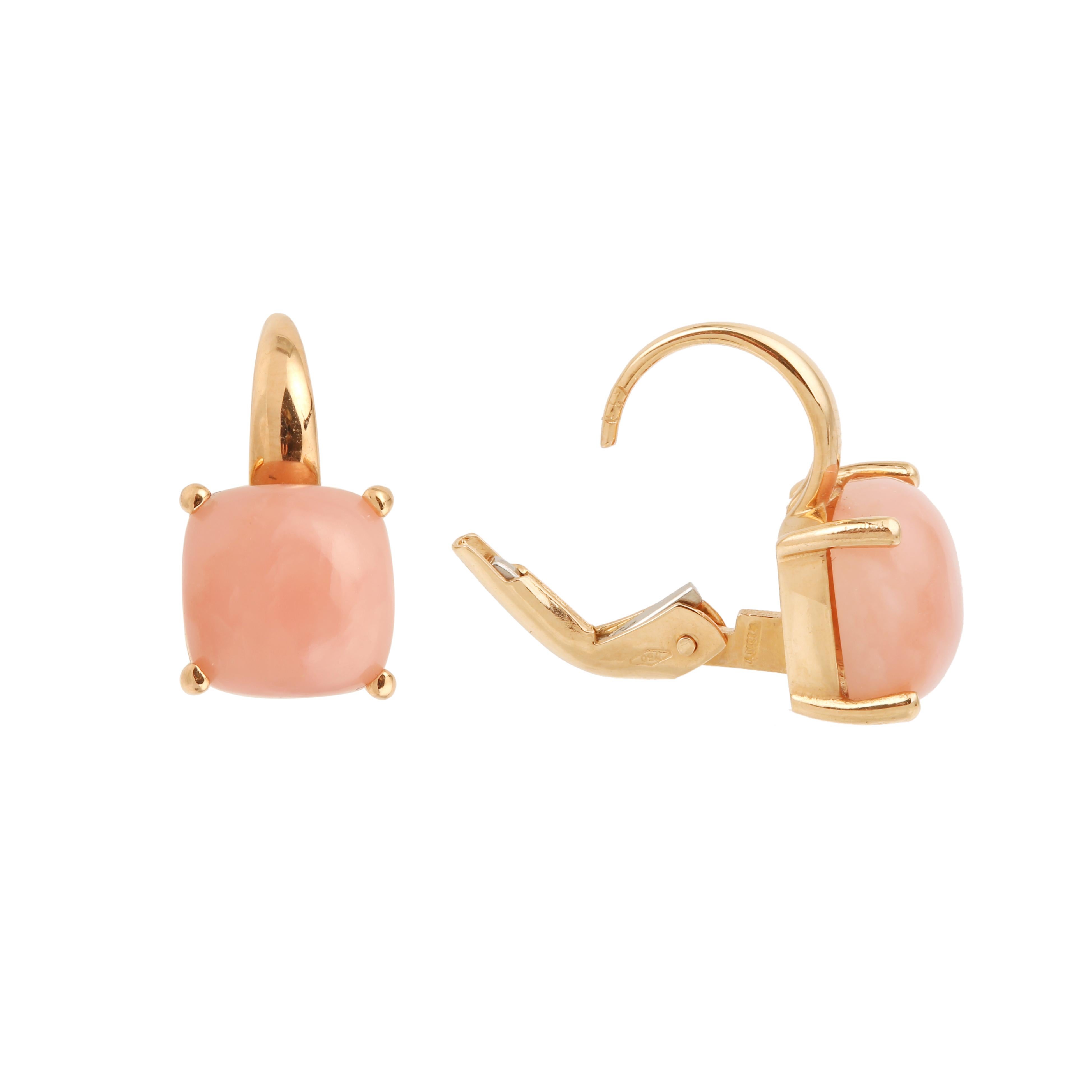 Pair of rose gold earrings set with pink opal cabochons.

Total estimated opal weight: 3 carats

Dimensions: 14.80 x 8.22 x 6.75 mm (0.582 x 0.323 x 0.265 inch)

French work circa 2000

Weight of earrings: 3.3 g

18-carat rose gold,