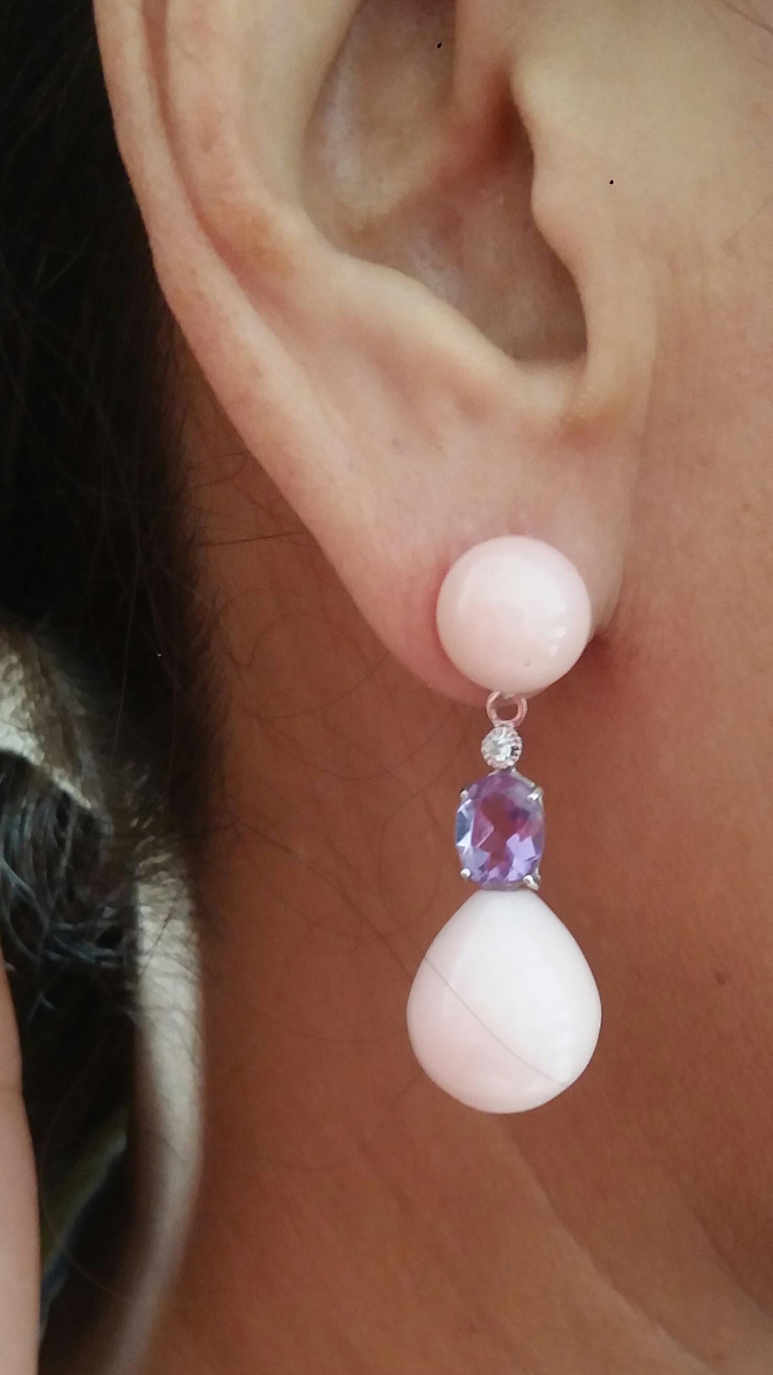 Tops are 2 Pink Opal round cabochon,then 2 oval faceted Amethyst and full cut round Diamonds set in White Gold are holding 2 Pink Opal round Drops.

In 1978 our workshop started in Italy to make simple-chic Art Deco style jewellery, completely