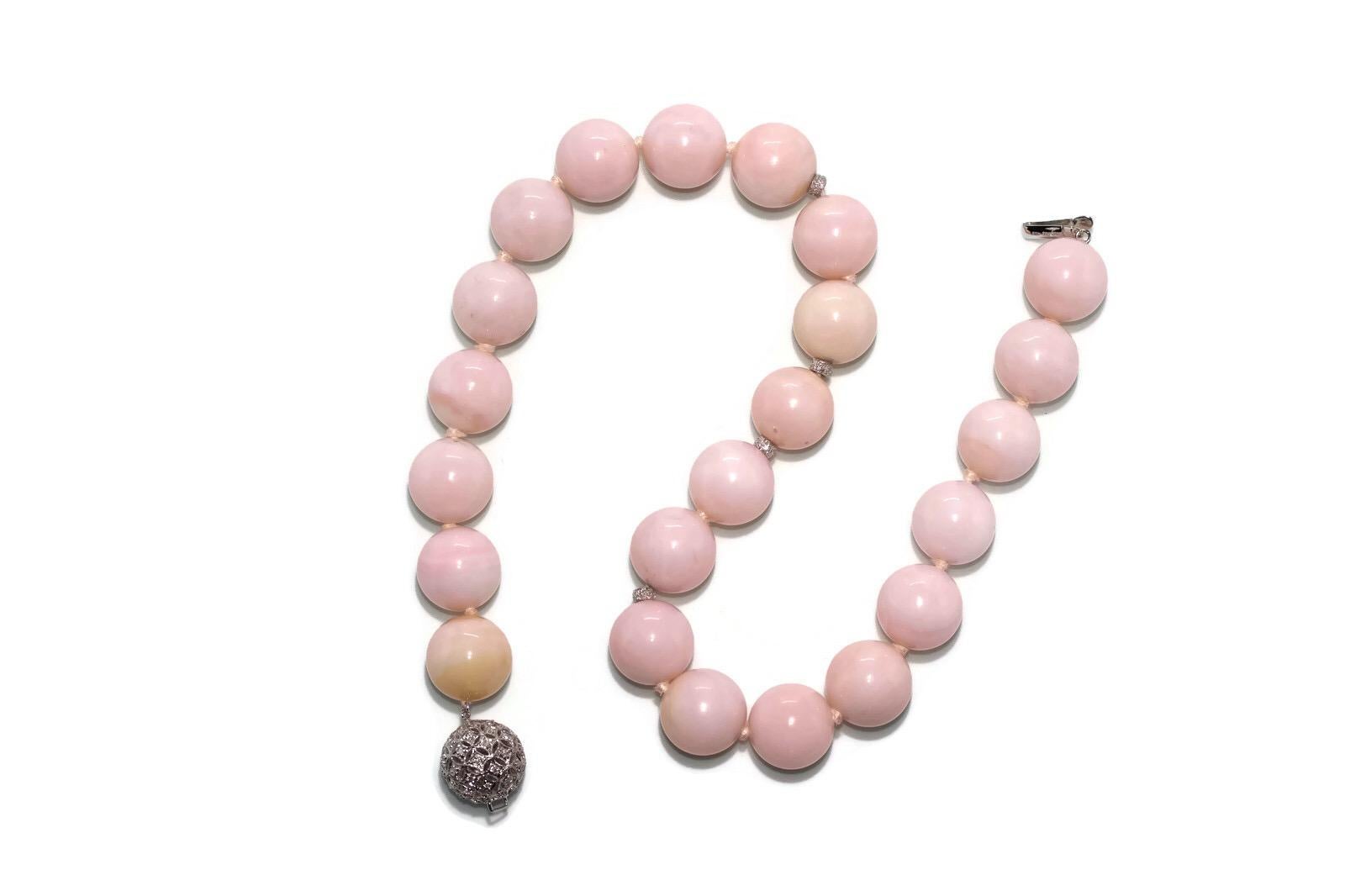 This important pink opal necklace has 16mm beads that really make a statement.  The 18k diamond clasp and diamond rondelles add the finishing touches to create a beautiful piece of jewelry.

Special and not common - this stunning necklace will get