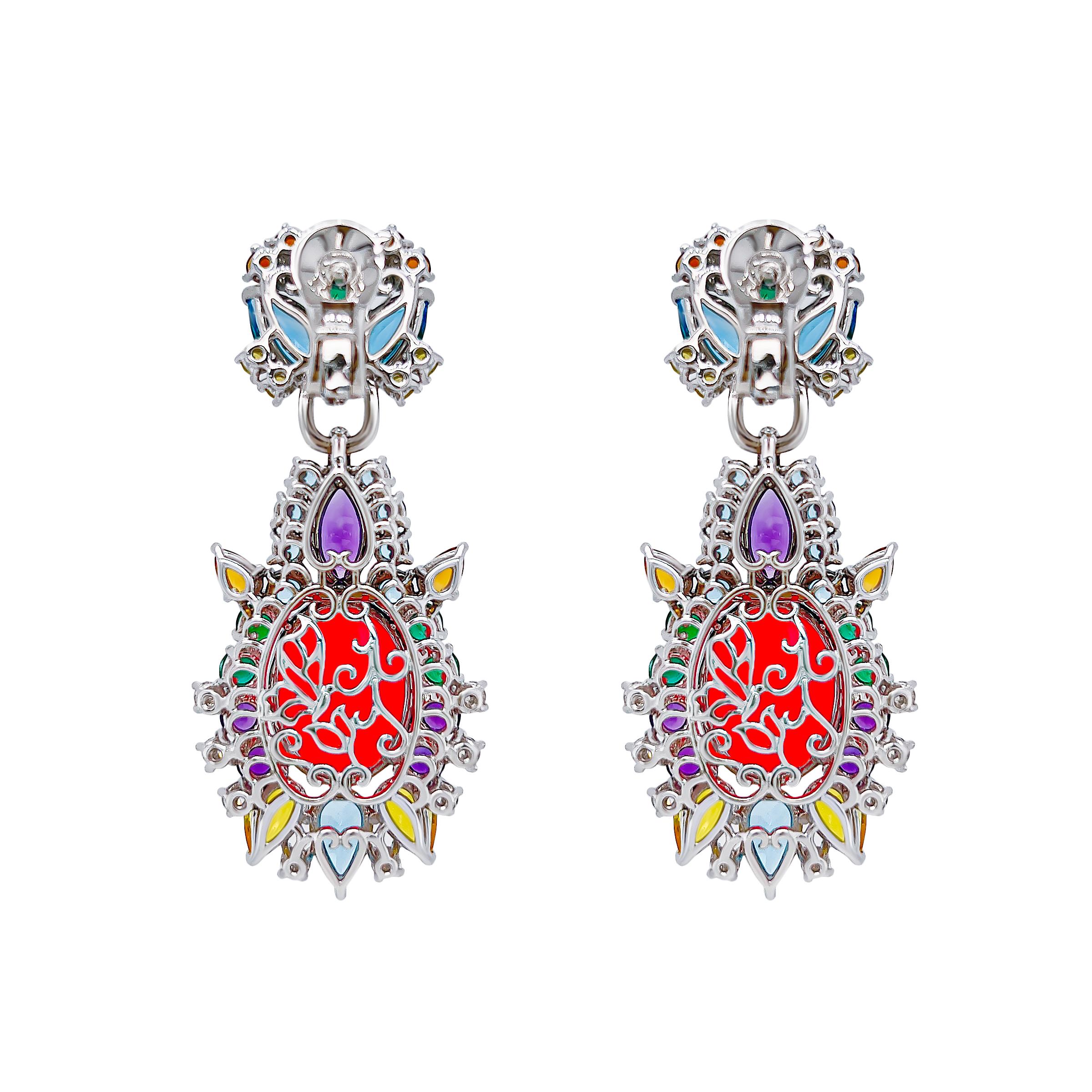 Show stopping hot pink opals weighing 13.38 carats are the centrepiece of these 18k white gold earrings. The pink orbs of pure magnetism are surrounded by hand selected natural coloured gems including, emerald, yellow sapphire, citrine, amethyst and