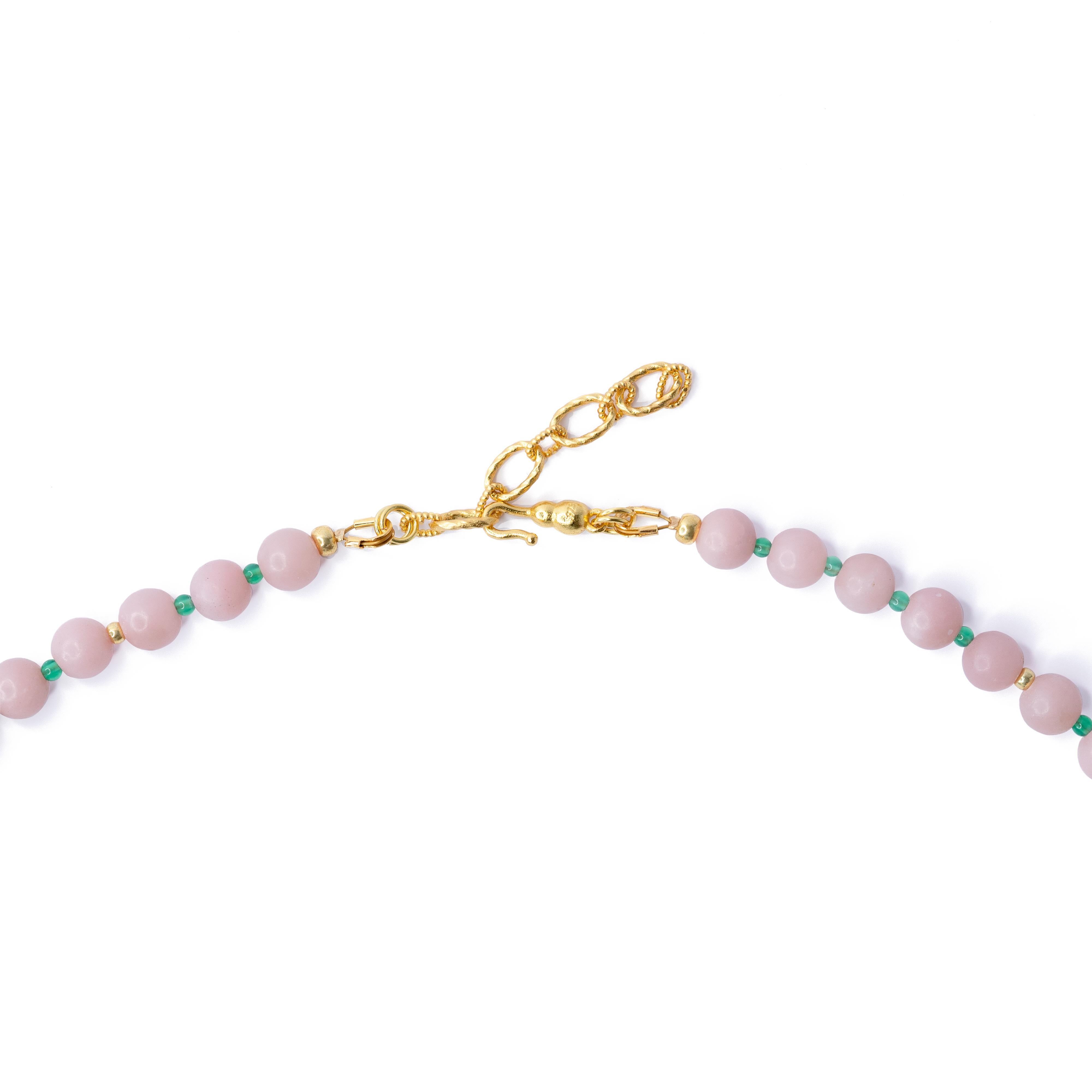 This necklace is crafted from Pink Peruvian Opal and Turquoise beads, finished with 22K Gold Plated Sterling Silver Adjustable hook.
	•	20