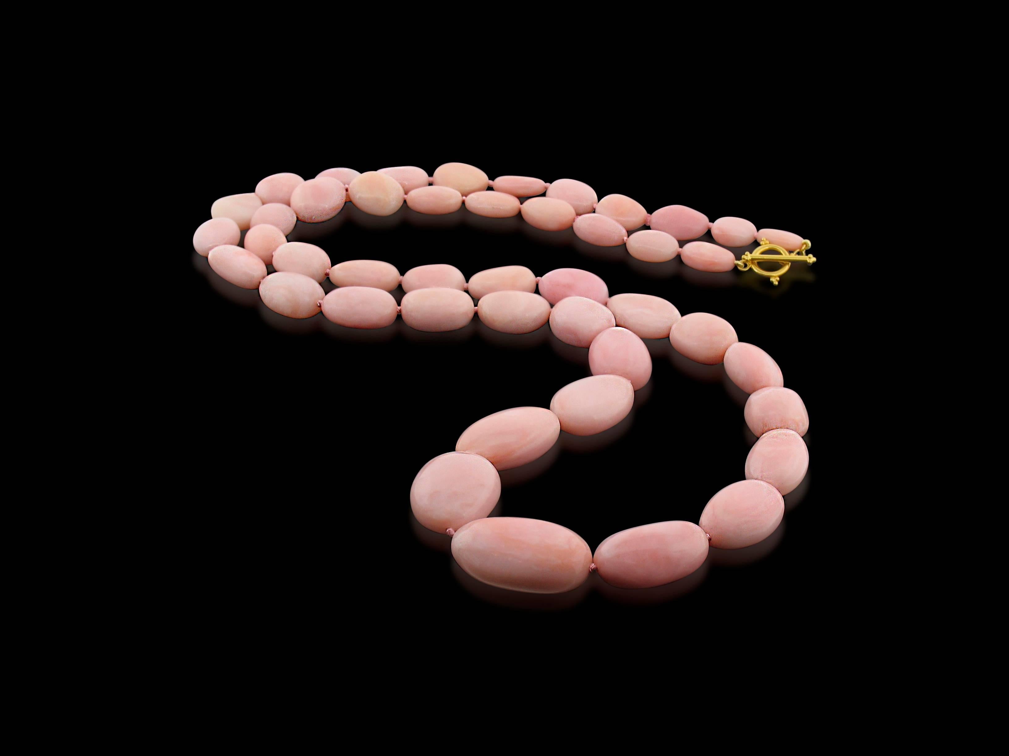This create a one-of-a-kind is a necklace unlike most you'll ever see. It showcases 700 carats of Pink Opal for a popular blush-pink palette. Fastens with a 14K yellow gold toggle clasp. 32