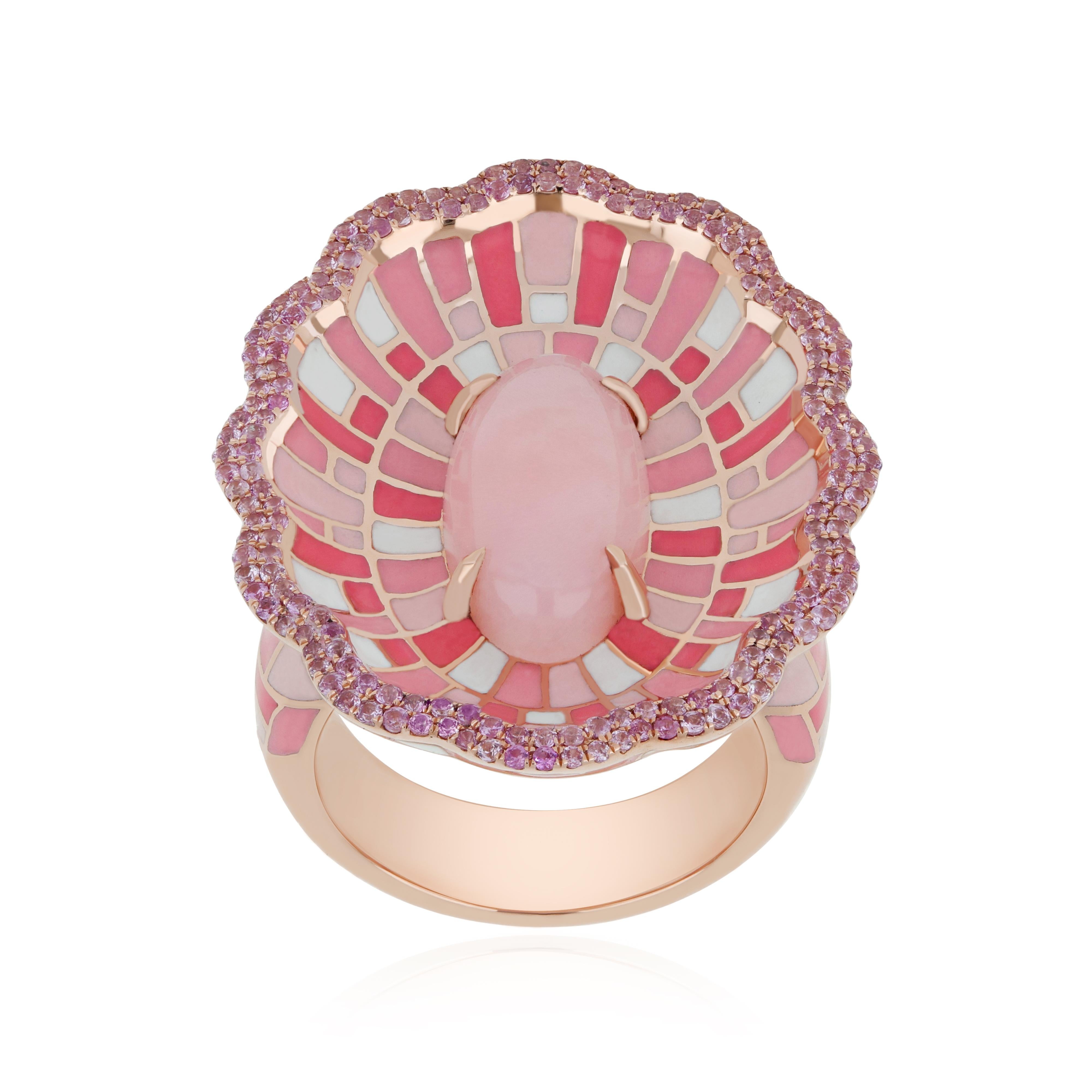 Immerse yourself in the epitome of luxury with our meticulously crafted 14 karat Rose Gold Ring. Adorned with a stunning 3.40 carat (approx.) Fancy Cut Pink Opal, this masterpiece is further elevated by a dazzling Halo of Pink Sapphires weighing