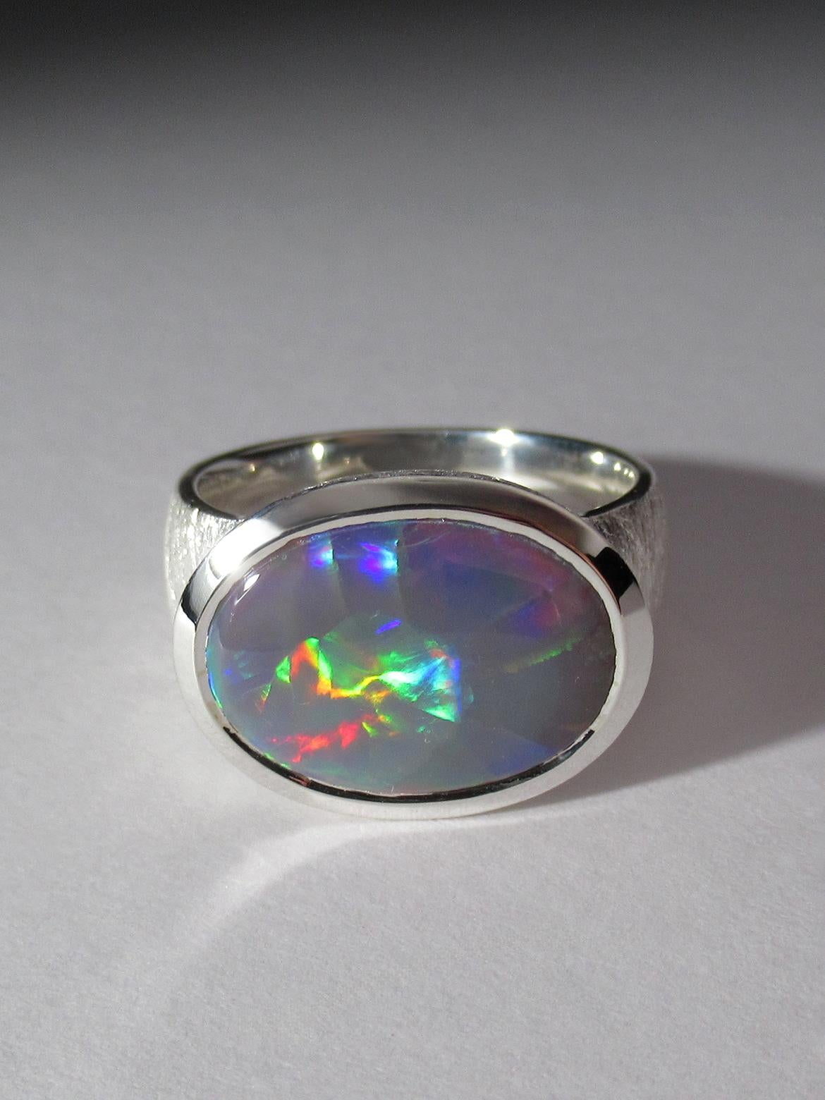Pink opalescence  fine quality Opal ring in silver
ring size - 8.5 US / 18.5 diameter / N 18 / 58 circumference
weight of the Opal 6.53 ct
gemstone origin - Australia
stone measurements - 0.16 х 0.35 in / 12 х 16 mm
ring weight - 9 grams