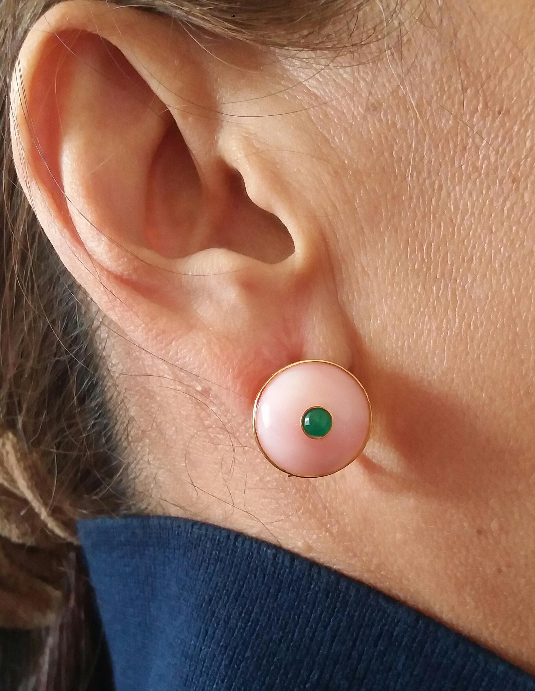 Simple elegant clip on earrings with round plain Pink Opal cabochons of 16 mm in diameter set in 14 Kt yellow gold  with a round Emerald cabochons of 4 mm in diameter,also set in 14 Kt yellow gold.
In 1978 our workshop started in Italy to make