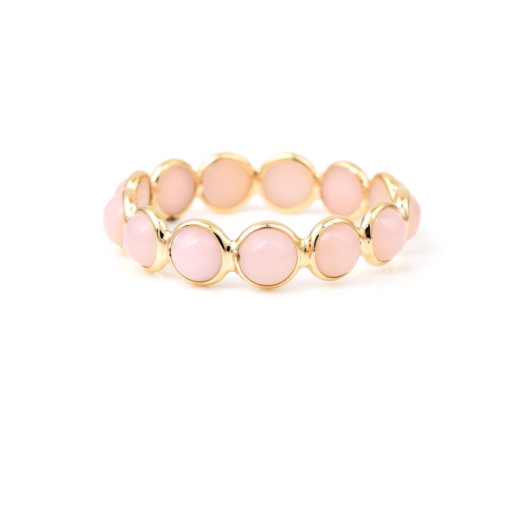 Shape: Round Cabochon

Stones: Pink Opal

Metal: 14 Karat Yellow Gold (can be customized)

Style: Single Line Band

Ring Size: US 7.50 (can be customized)

Stone Weight: appx. 2.80 carats of Pink Opal

Total Weight: 1.07 grams
