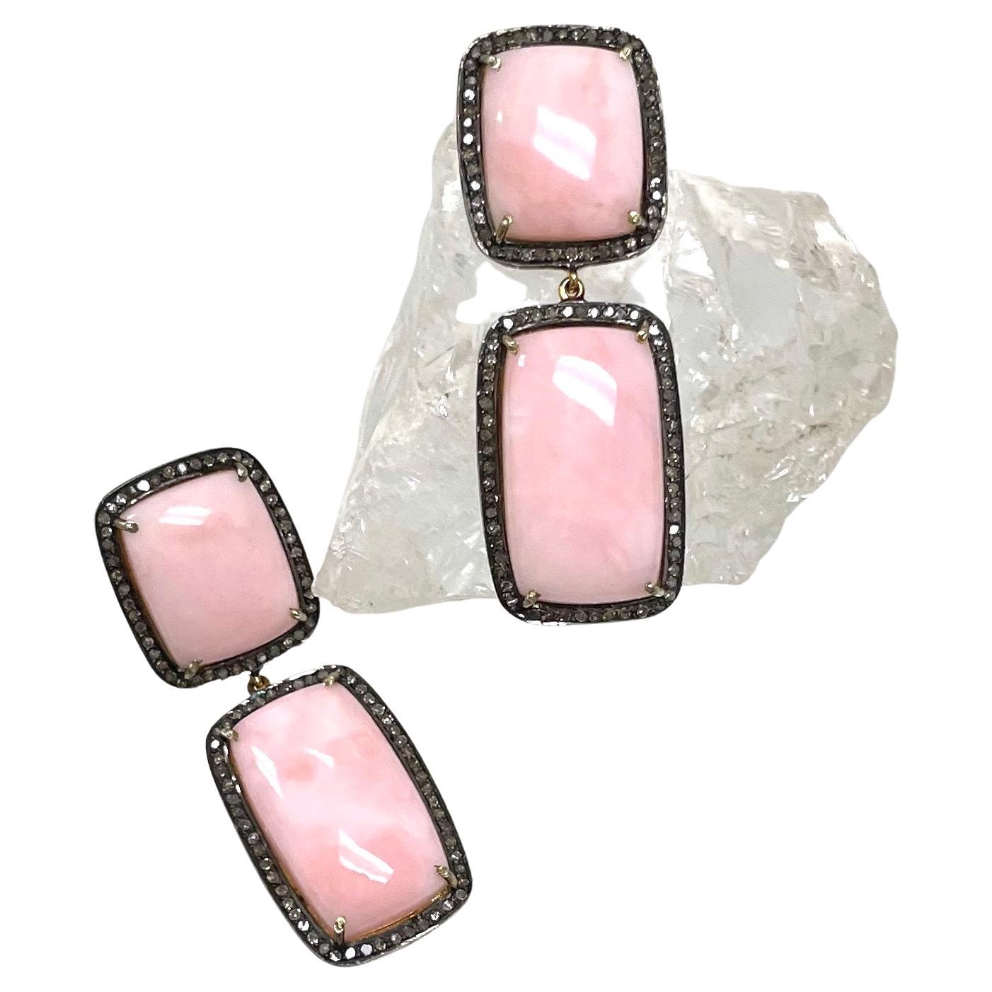 Description
The geometrically shaped pink opal, framed with pave diamonds set in a black background, creates a stylish contrast and an impressive statement. 
Item #E2421

Materials and Weight
Pink opals 44cts
Pave diamonds 1.32cts
Vermeil
14k yellow