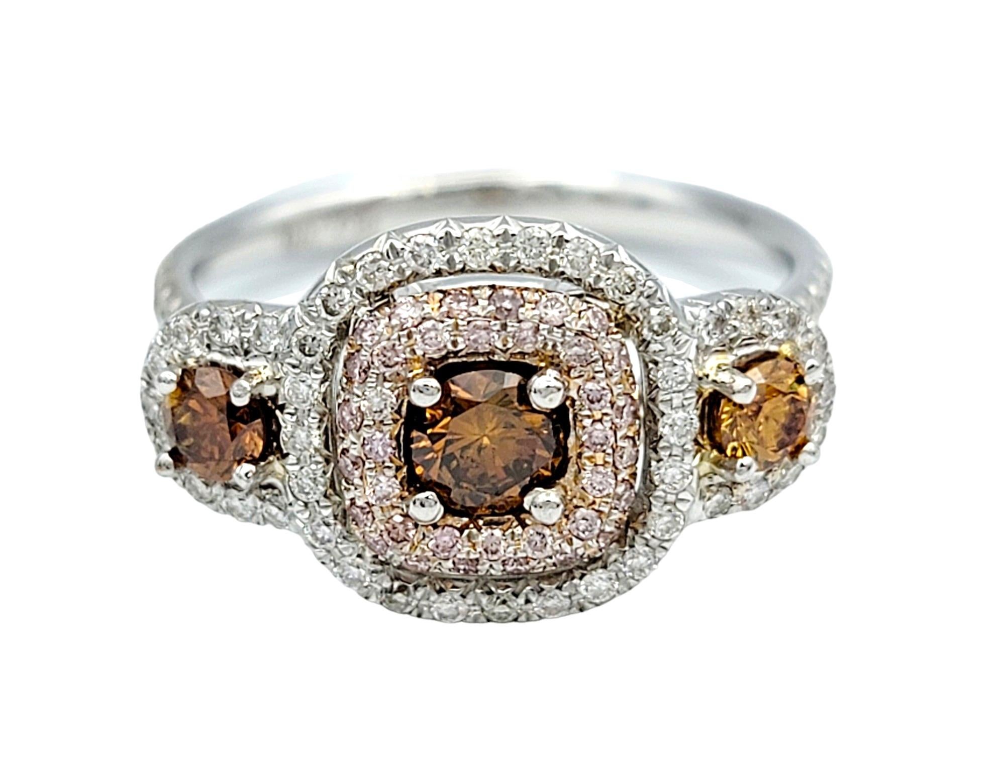 Round Cut Pink, Orange and White Diamond 3-Stone Halo Style Ring in 18 Karat White Gold For Sale