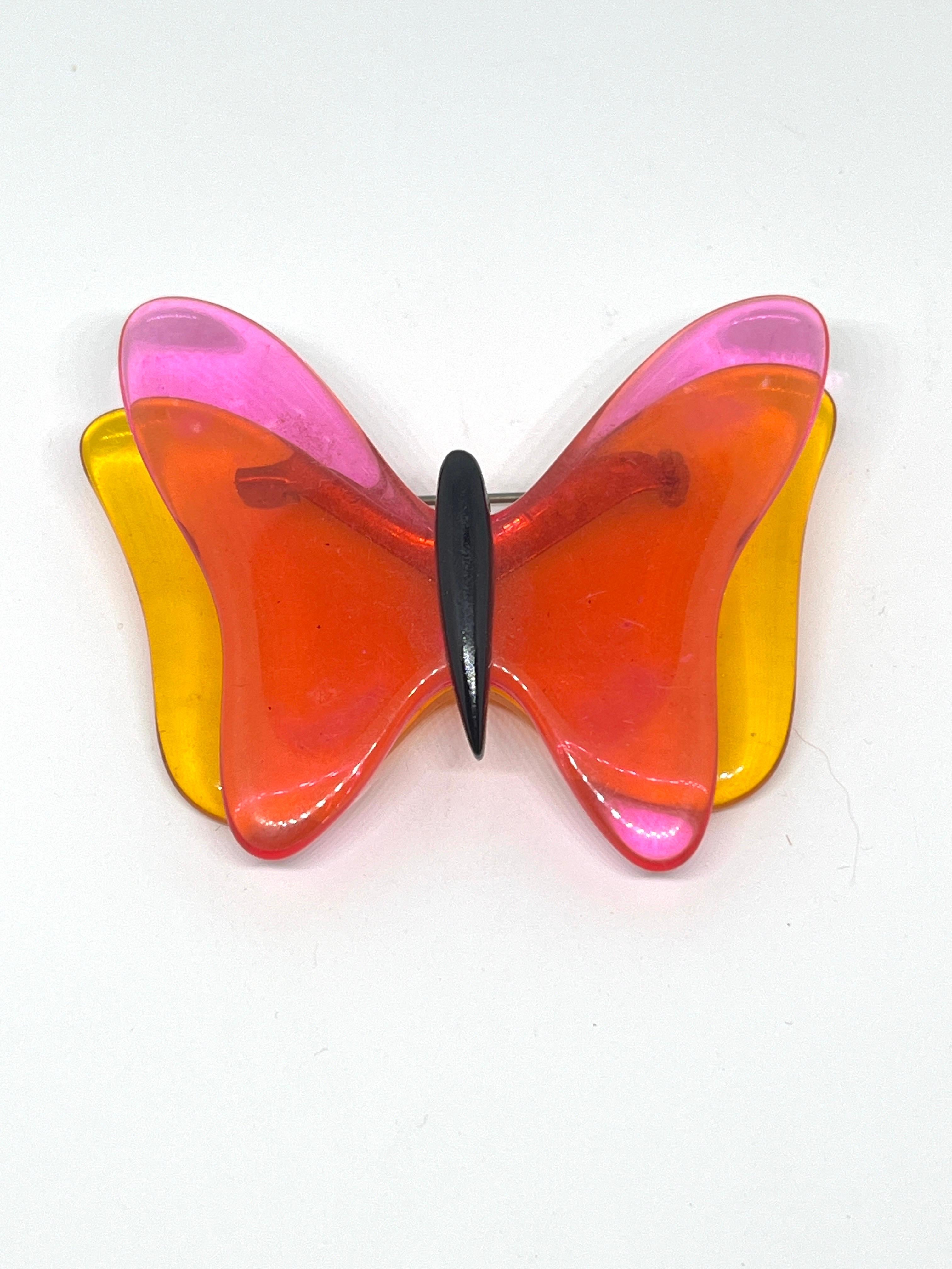Pink Orange Lucite Twiggy-style Mod Butterfly Brooch 1960s, transparent double layer 

Traveling to us through time from the Laugh-in Era; The Swingin’ Sixties, I bring you this rare and unusual find. You will likely be the only one you know with an