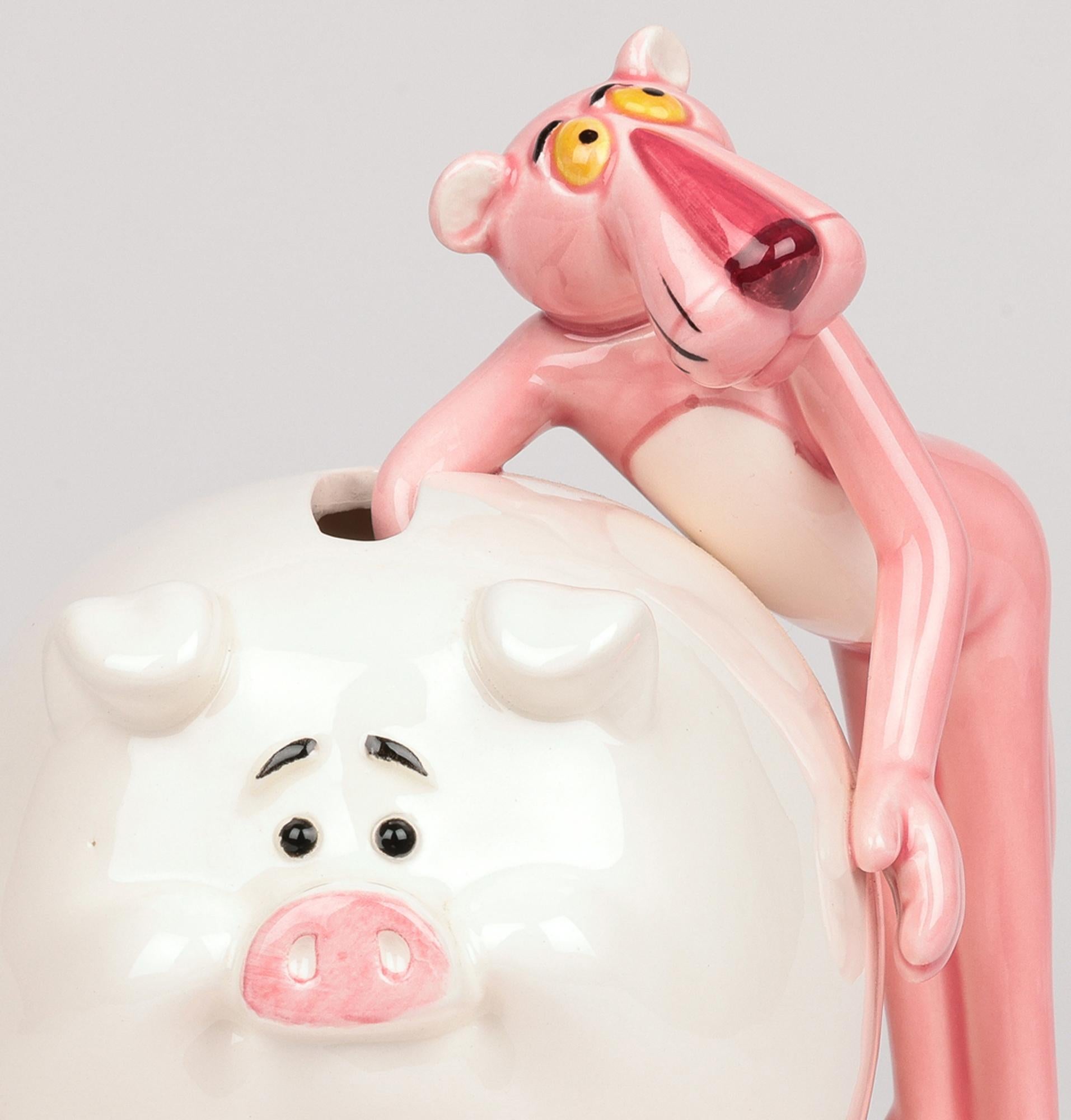 A delightful, Japanese licensed Pink Panther Collection pig form money box straddled by a figure of the Pink Panther distributed by Royal Orleans and dated 1981. The ceramic pig stands on a large slightly domed oval base and is of large, rounded