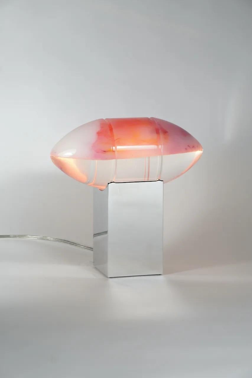 Pink Peach Helios Lamp by Zoran Strijbosch
Handmade
Dimensions: 
Base: D 9 x W 9 H 15 cm
Sphere: D 10.5 x W 10.5 x H 25 cm
Materials: Aluminum, acrylic.

In ancient times, Helios was revered as the god of the sun, entrusted with the responsibility