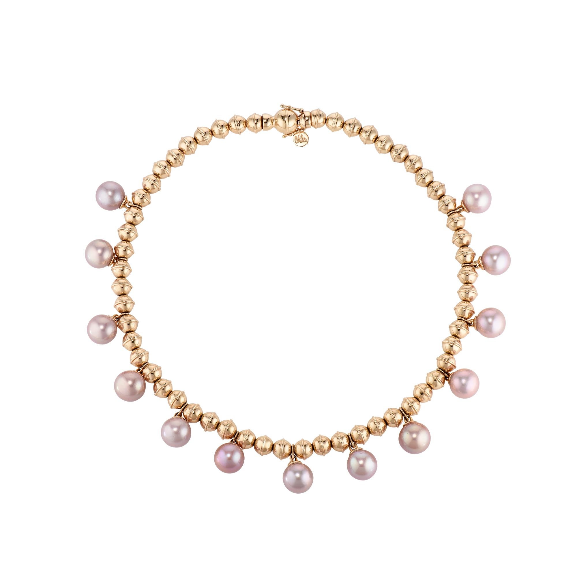 From the American Southwest and beyond, this elegant yet edgy 14 Karat yellow gold Marlo Laz Squash Blossom bead collar with dancing and dangling Pink Pearls, allows you to carry the serenity and the mystic of the desert with you, wherever you go.