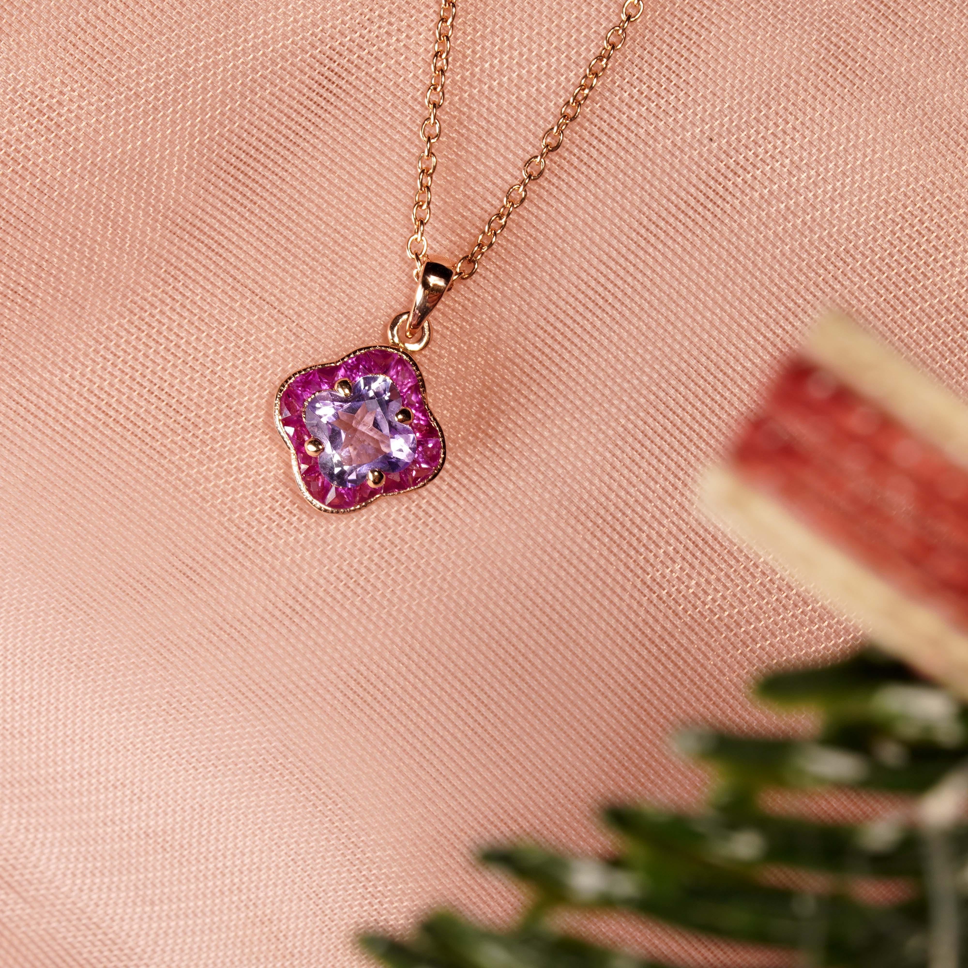 Sophisticate and classy, this design pendant necklace is inspired by the beauty of Pink Perfection Lily Flower. The center stone of shining Lily cut pink amethyst brings you the good luck and fortune, surrounded by French cut rubies, as the flower