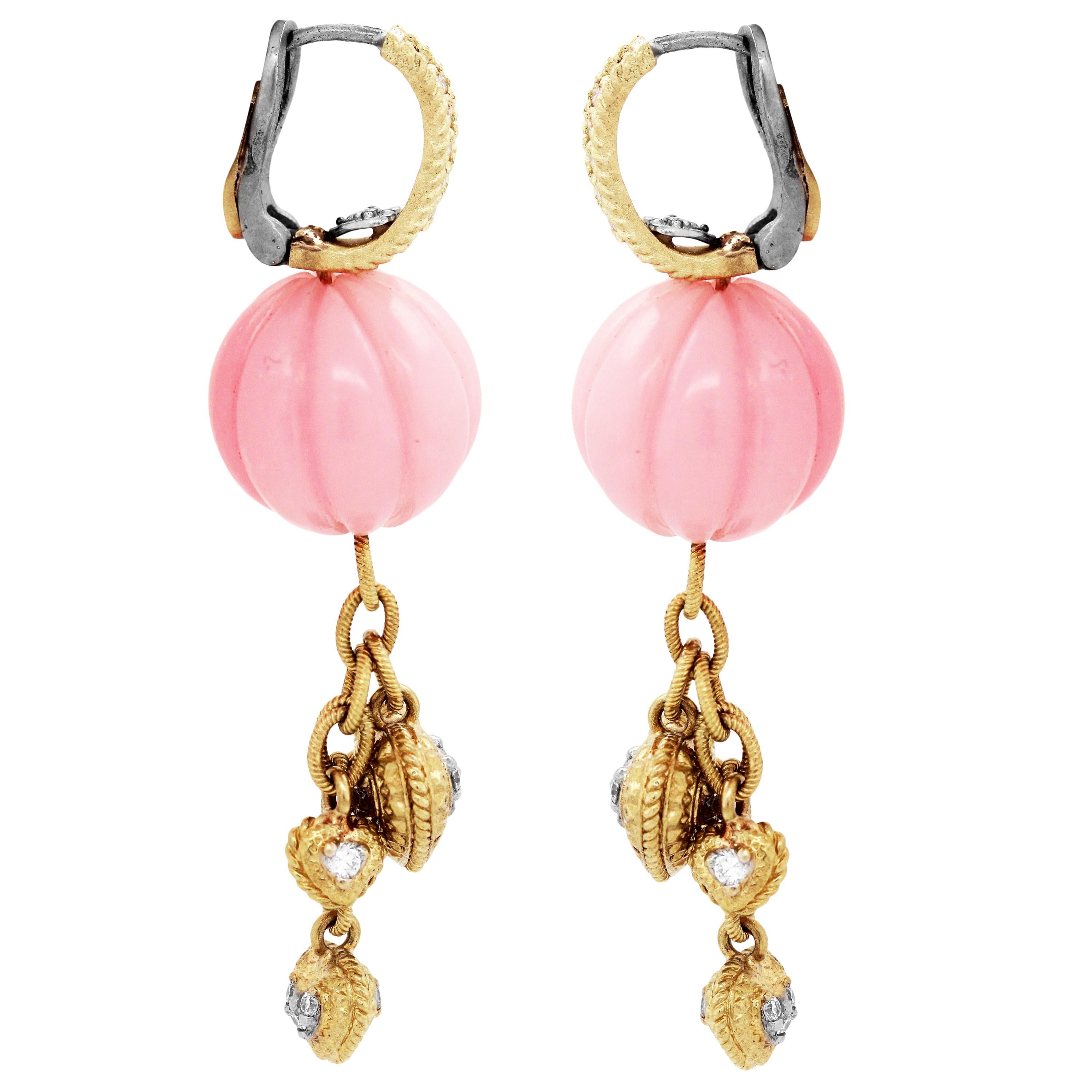 18K Yellow Gold and Diamond Drop Earrings with Dangling Hearts and Pink Peruvian Opals by Stambolian

These state-of-the-art earrings make for a fun addition to any outfit with the vibrant and joyful Pink Peruvian Opals and gold combination.

The