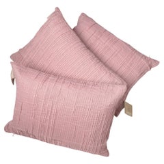 Almohadas plisadas rosas
