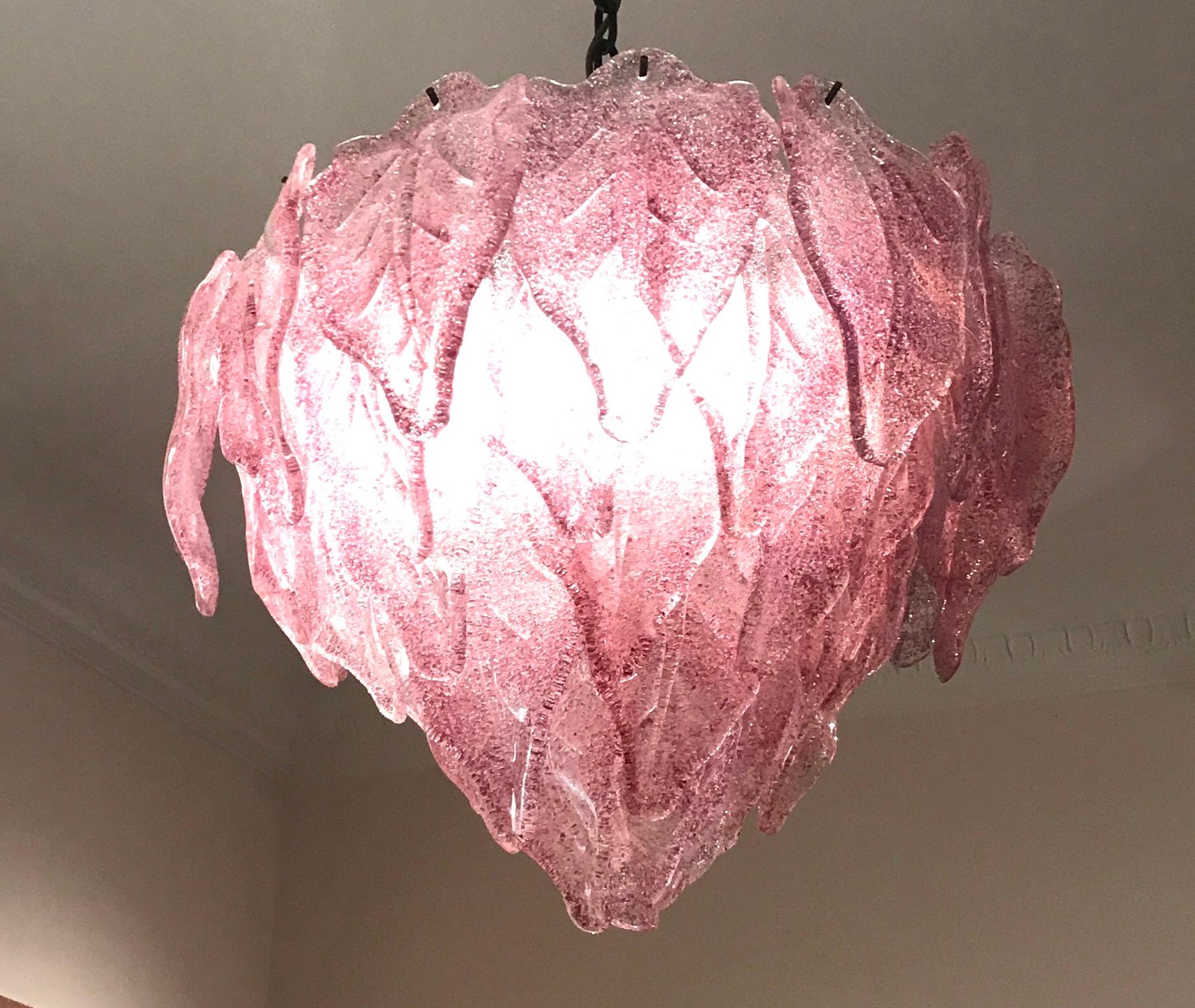 Spectacular Murano chandelier. It consists of dozens of pure Murano glass leaves.
Four E 27 lights.
Available also a pair.

Measures: Height with chain cm 100 (39 inches)
without chain cm 40 (16 inches).