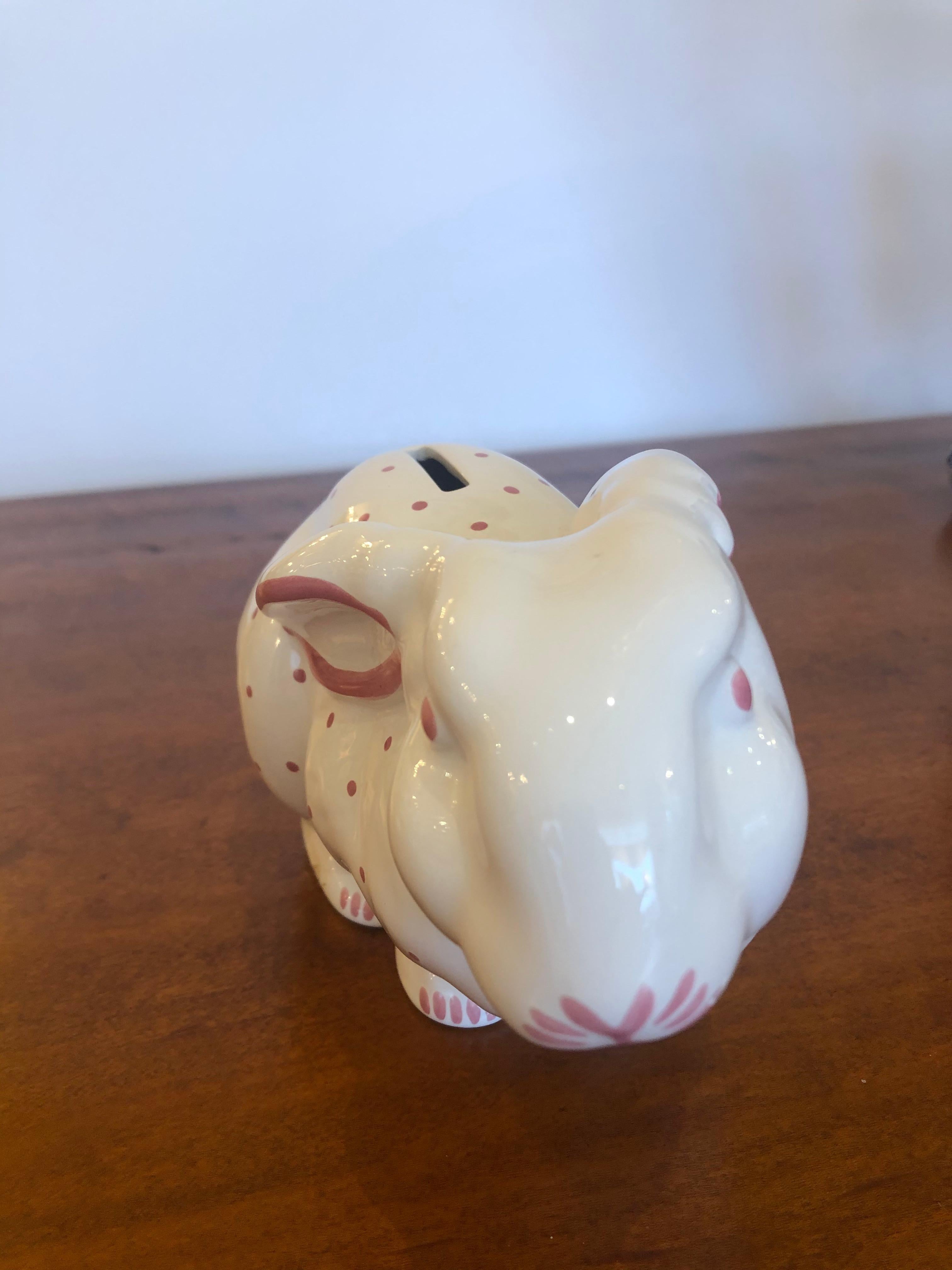 Charming pink and white polka dot femme bunny rabbit piggy bank by Tiffany, marked on the bottom.