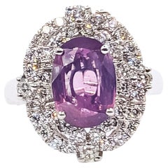 Bague de cocktail en platine sertie d'un saphir rose-violet et d'un halo de diamants – GIA 6237890504