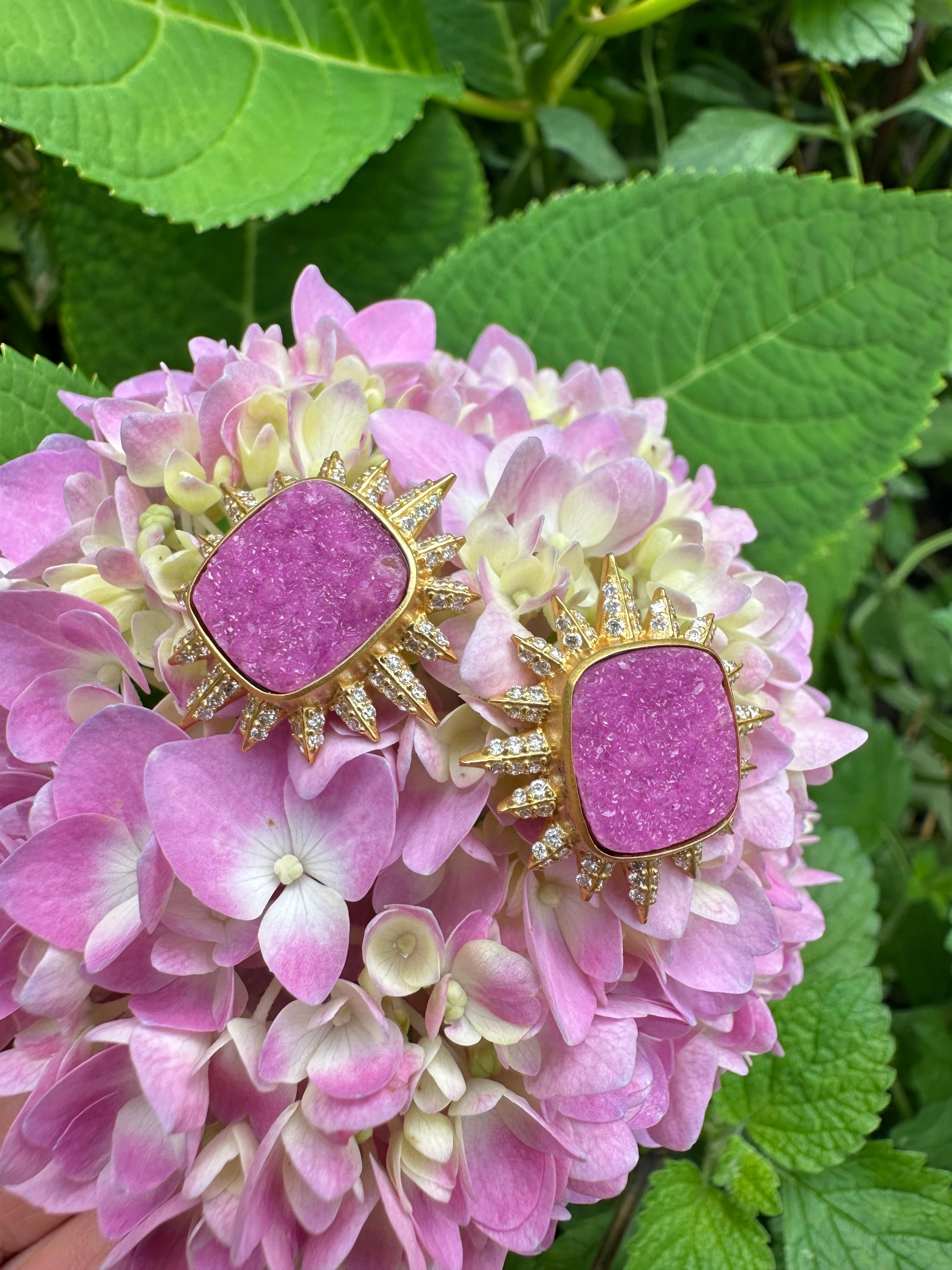 Bright and faceted white diamonds surround a center square Pink Crystal Quartz stone, all set in a spectacular 18kt Gold setting in a spikey sunburst design.  Designed by award winning jewelry designer, Lauren Harper, these studs are a statement of