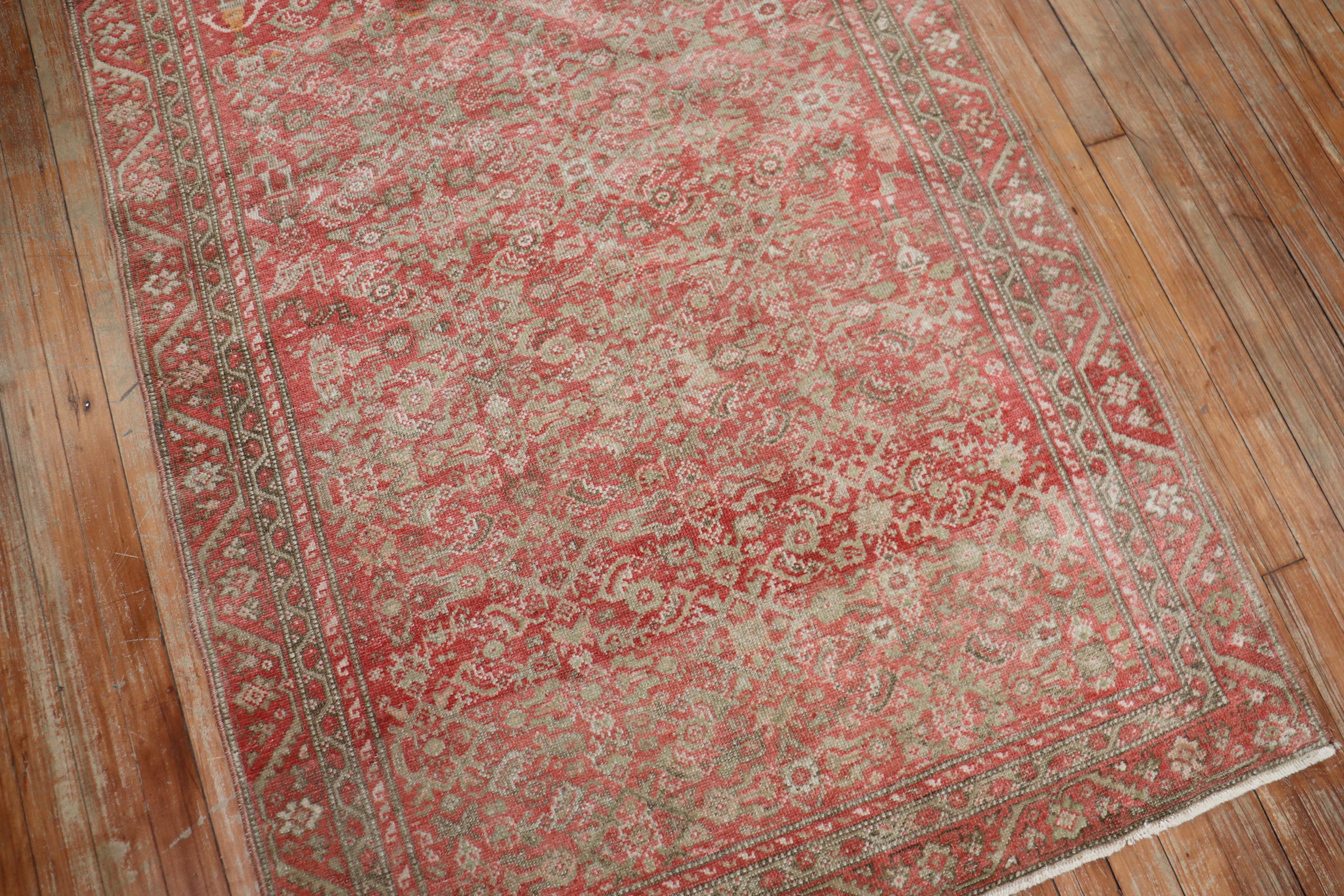 A small size early 20th century Persian Malayer rug with an all-over traditional Herati design in a dominant pink and red color. Accents in brown as well

Measures: 3'6