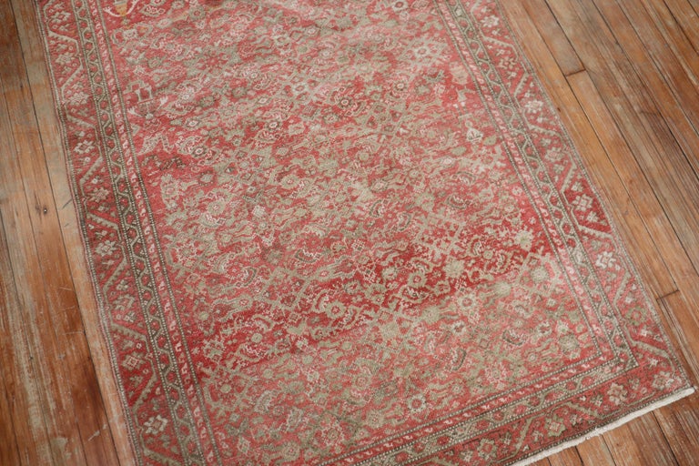 A small size early 20th century Persian Malayer rug with an all-over traditional Herati design in a dominant pink and red color. Accents in brown as well

Measures: 3'6