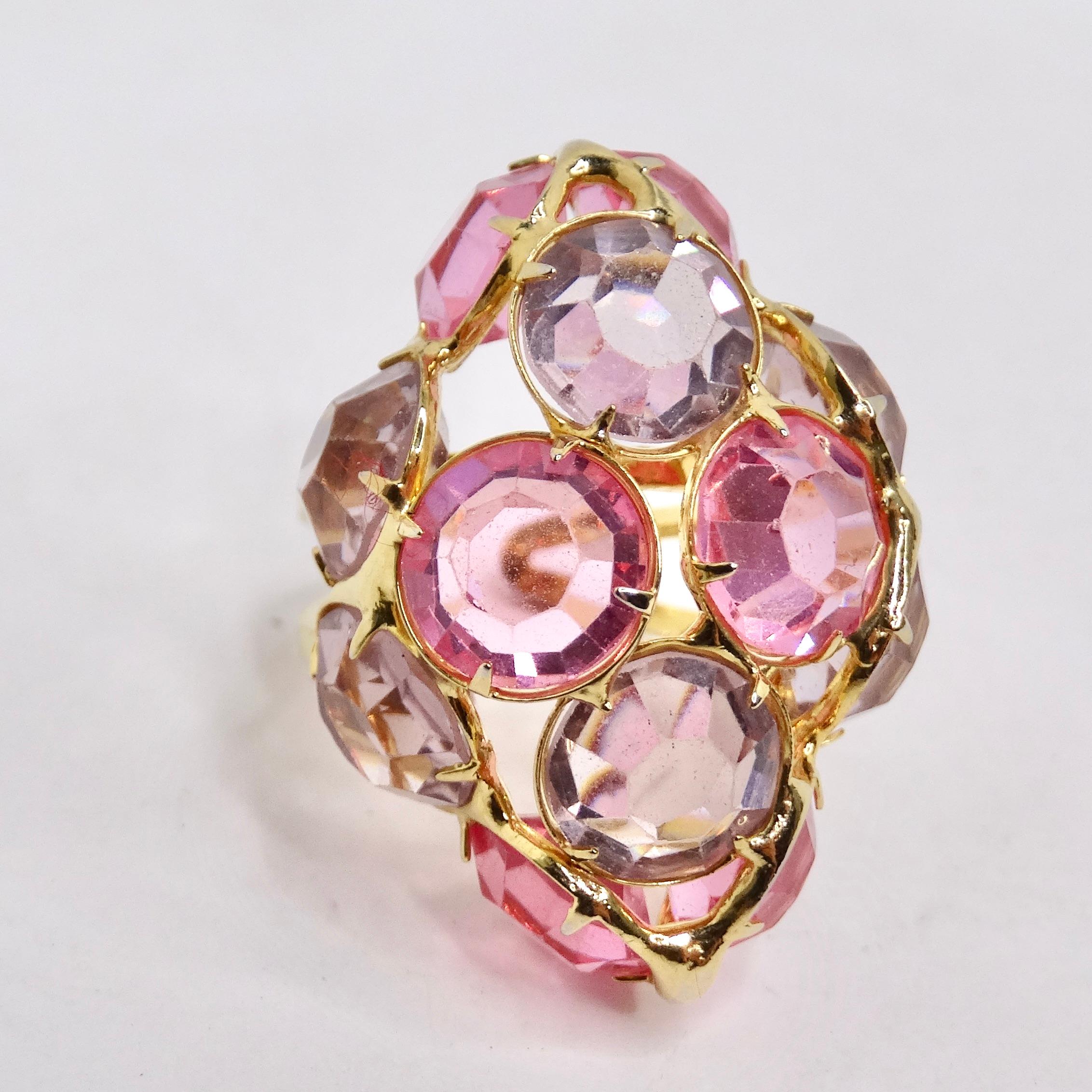 Elevate your style to new heights with our exquisite Pink Rhinestone 18K Gold Plated Cocktail Ring, a glamorous statement piece that will leave a lasting impression. Crafted in the 1970s, this ring boasts a stunning cluster of light pink and purple