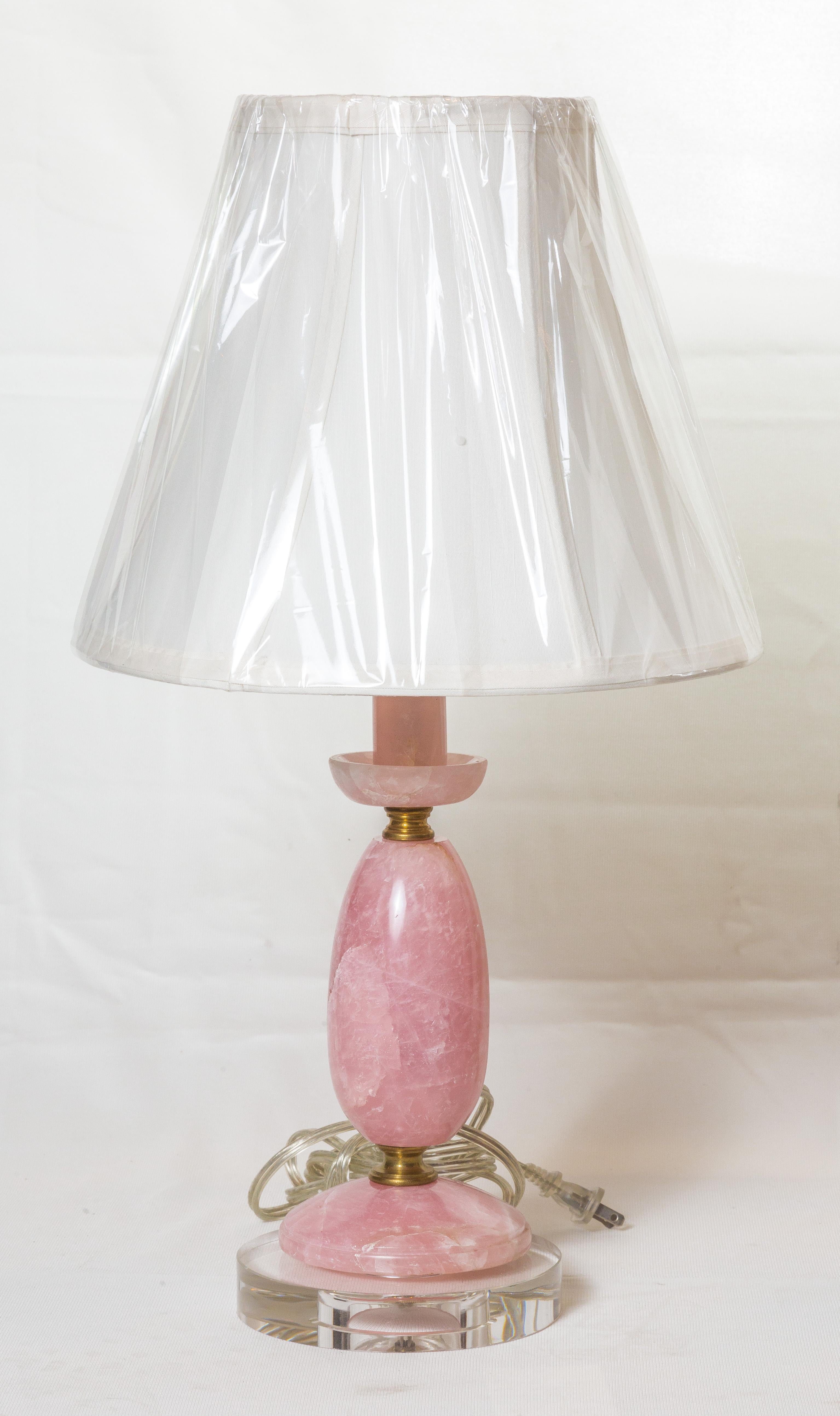 Unique pair of pink rock crystal lamps, handmade from Brazil, One light on ea. lamp.
American wire, in excellent conditions. The lamp sits in a 6