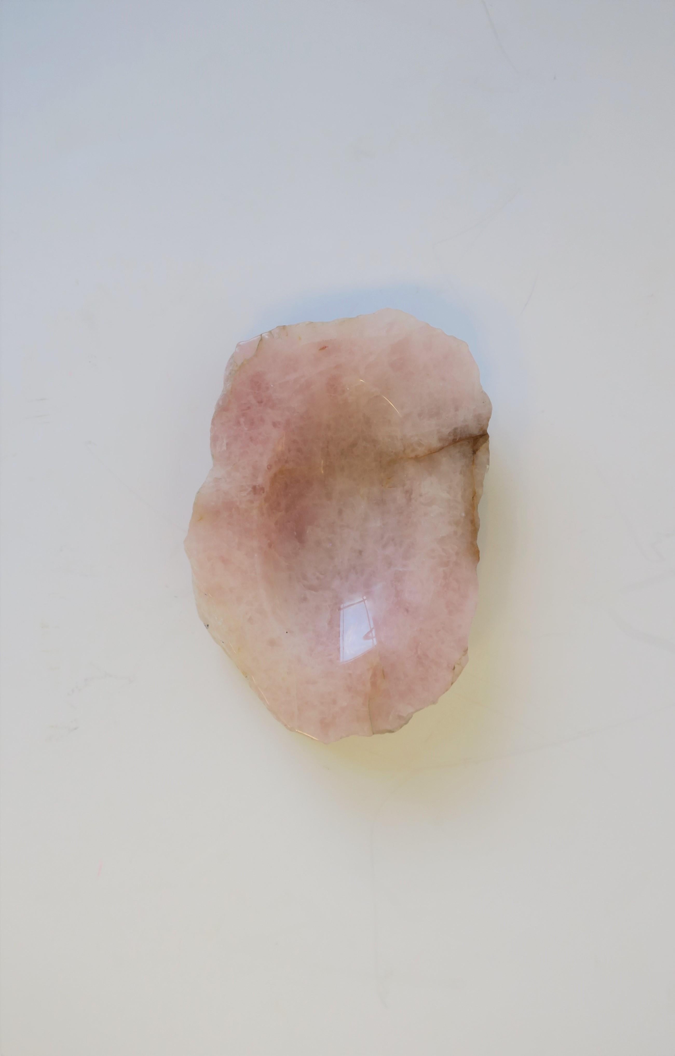 A beautiful and substantial pink rose quartz polished vessel, jewelry or dish, circa 20th century. A beautiful piece with polished oval surface/indent to hold small items or jewelry (as demonstrated) on a desk, vanity, walk-in-closet, nightstand