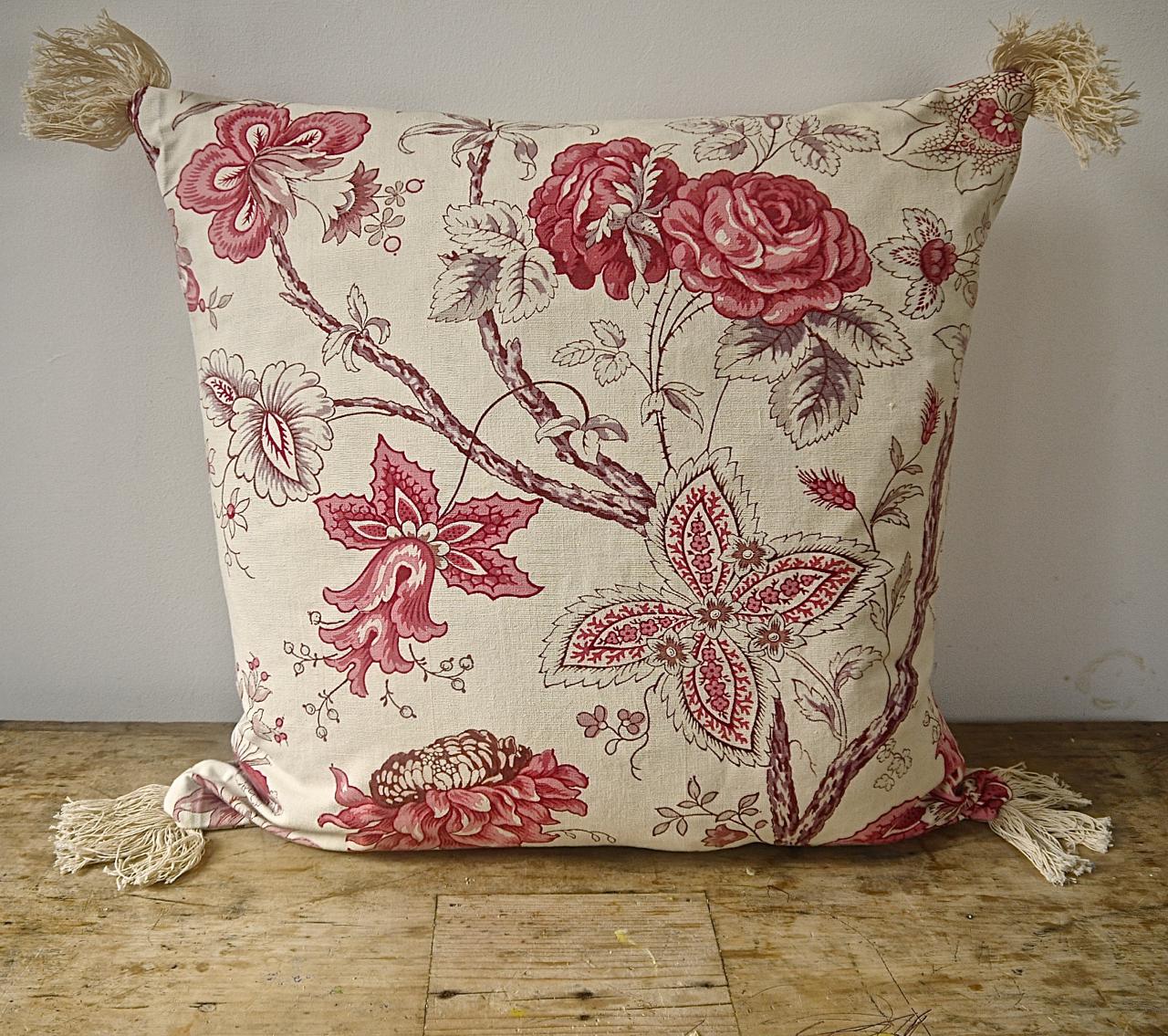 French early 20th century large scale pink and red roses with stylized flowers and leaves on meandering branches cushion. With vintage cotton fringing at each corner. Self-backed and slip-stitched closed with a duck feather insert.