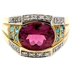 Ring aus 14 Karat Gelbgold mit rosa Rubellit, Granat, blauem Paraiba und Turmalin