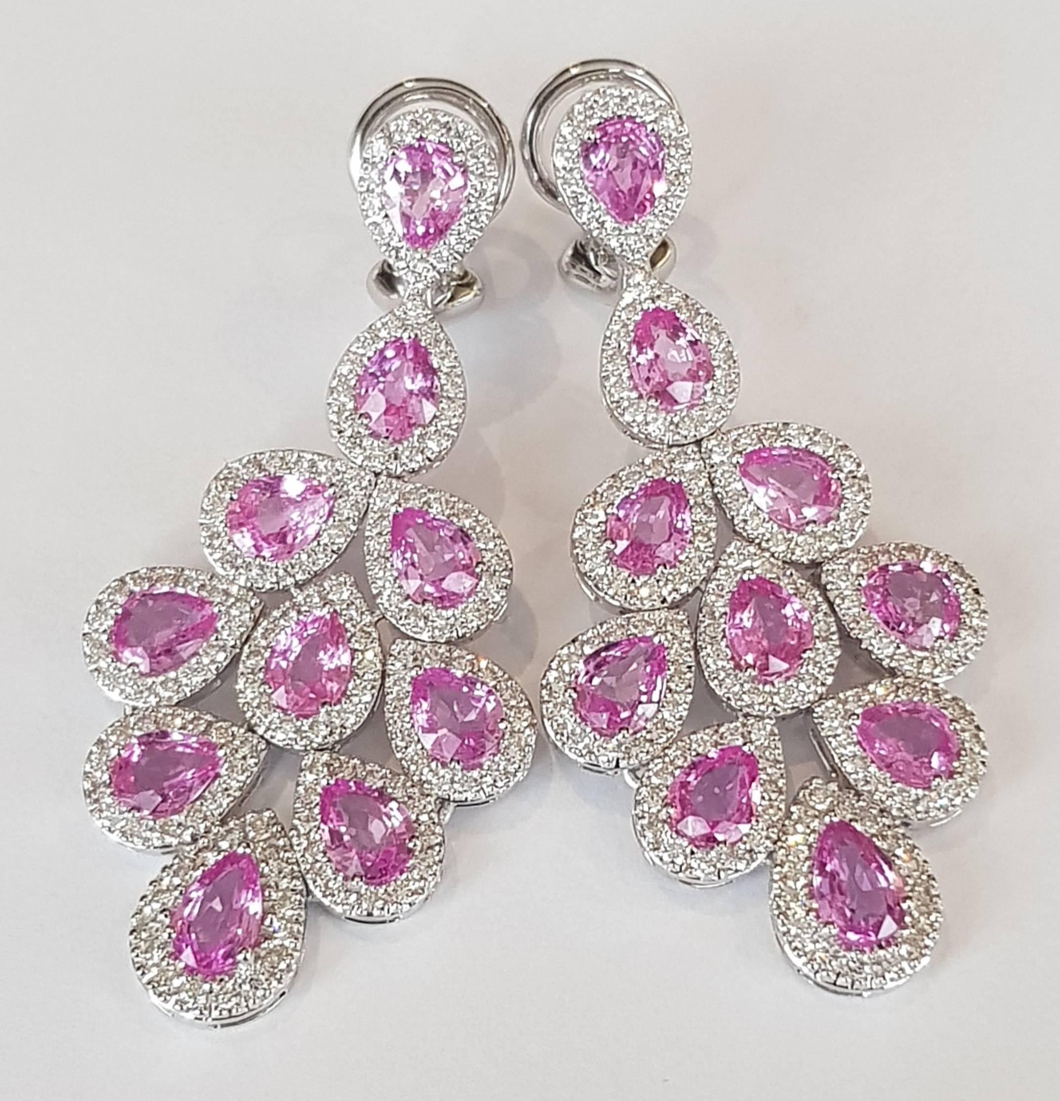 Pink Sapphire and Diamond Dangle Earrings
284 diamonds 2.31 ct
20 pink sapphires 7.56 ct
18 karat white gold 
come with clips and studs/ either can be removed free of charge