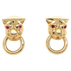 Boucles d'oreilles panthère nœud de porte en or jaune 18 carats et saphir rose des années 1980