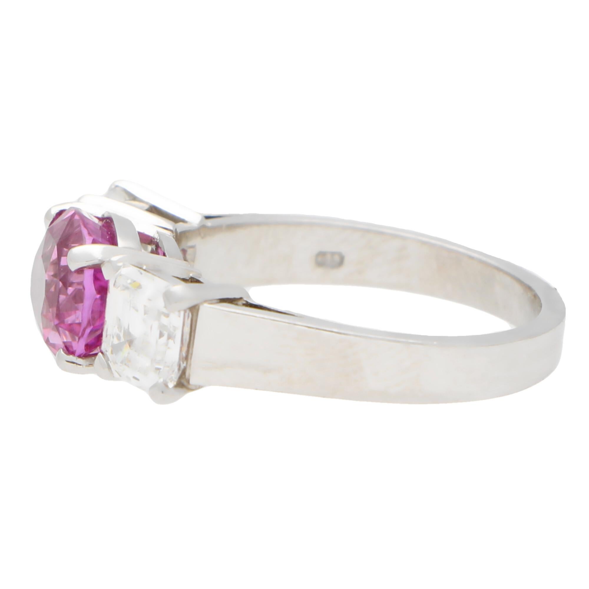 pink three stone emerald cut engagement ring