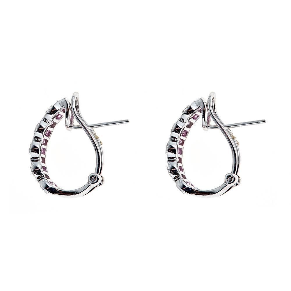 Casted in 14k white gold these pair of earrings have approximately 3.16 CT in baguette cut sapphires and approximately .19 CT in round Diamonds.