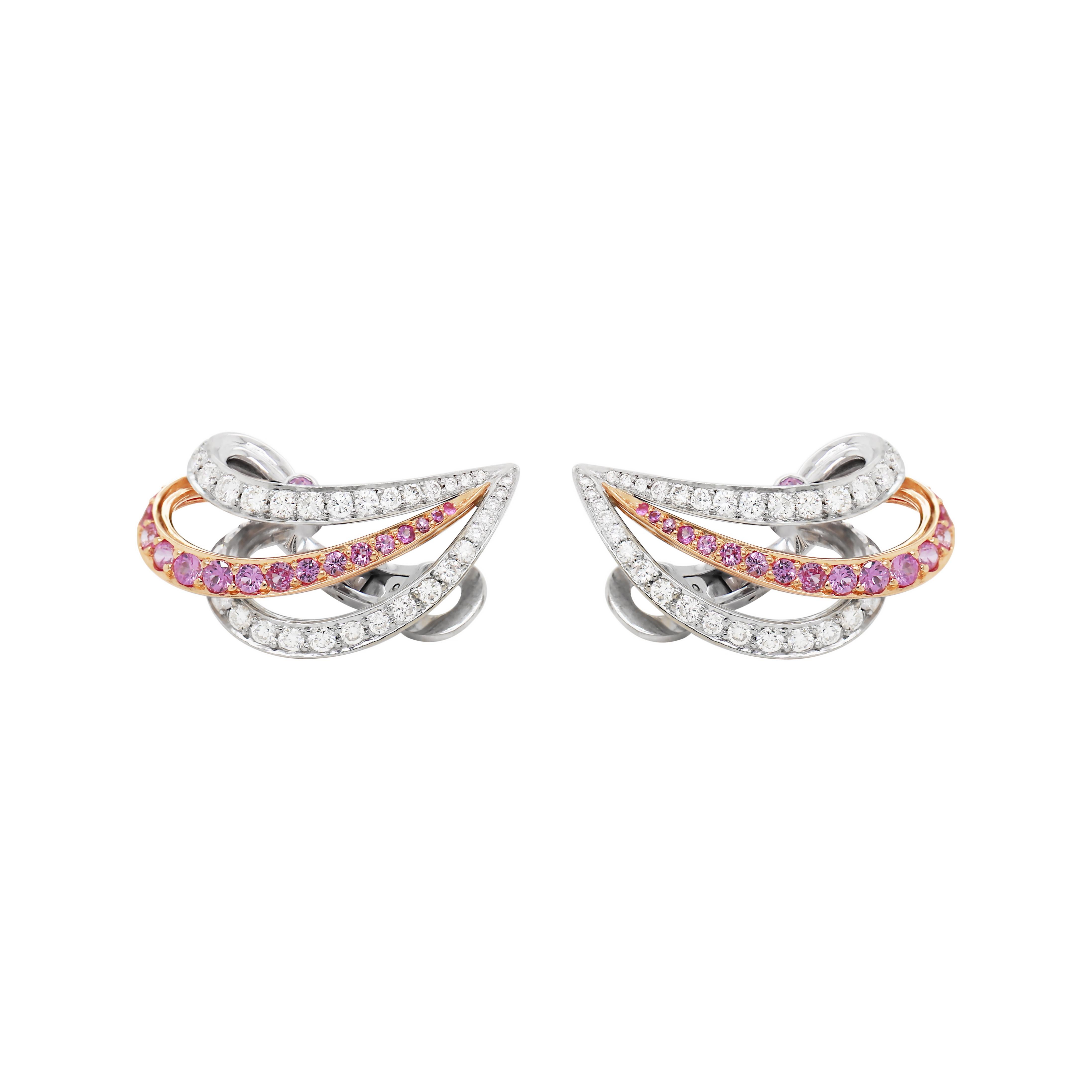 These beautiful three row swirl clip on earrings are pavé set with 40 fine quality round brilliant cut diamonds weighing approximately 1.10ct and 23 pink sapphires weighing approximately 1.00ct in each earring. The sapphires are mounted in 18ct rose